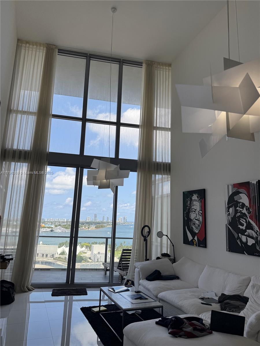 Gorgeous loft 2 story 1 bed plus dent  1 bath 1/2 
condo offers breathtaking views of Biscayne Bay, the ocean, and the cityskyline. Featuring a European-style kitchen with top-of-the-line, luxurious appliances, it’s designed for modern living.Glass stair & Glass rail- Enjoy a large private balcony, new bathroom floors, and spacious walk-in closets.Located in a full-service luxury building,The property is ideally situated on Biscayne Blvd, directly across from museums and the Performing Arts Center, just minutes from the beaches, the airport, and Brickell. A must-see property for those seeking the ultimate in luxury living!