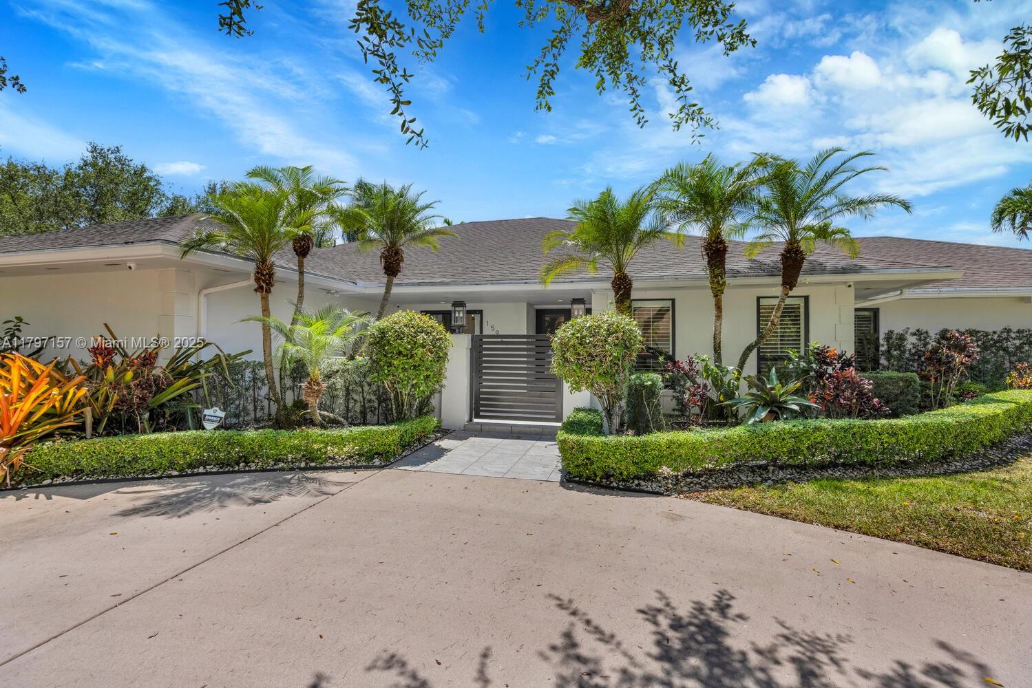 Picture-Perfect Home in Palmetto Bay! Nestled in a quiet cul-de-sac, this stunning home boasts four bedrooms, two and a half bathrooms, indoor laundry room, 2018 roof, impact doors/windows, full-house generator, and split-bedroom layout. The elegant white kitchen with vaulted tongue & groove ceiling overlooks a saltwater pool, screened patio, summer kitchen, and covered seating area—ideal for entertaining. Enjoy marble-like tile throughout, Plantation shutters, a spacious primary suite with luxe bathroom and walk-in closet, plus a new awning carport and concrete driveways. KitchenAid fridge (2023), new water heater, beautiful custom millwork throughout, lush mature landscaping, privacy wall, and abundant natural light. No flood zone! Property larger than tax roll.