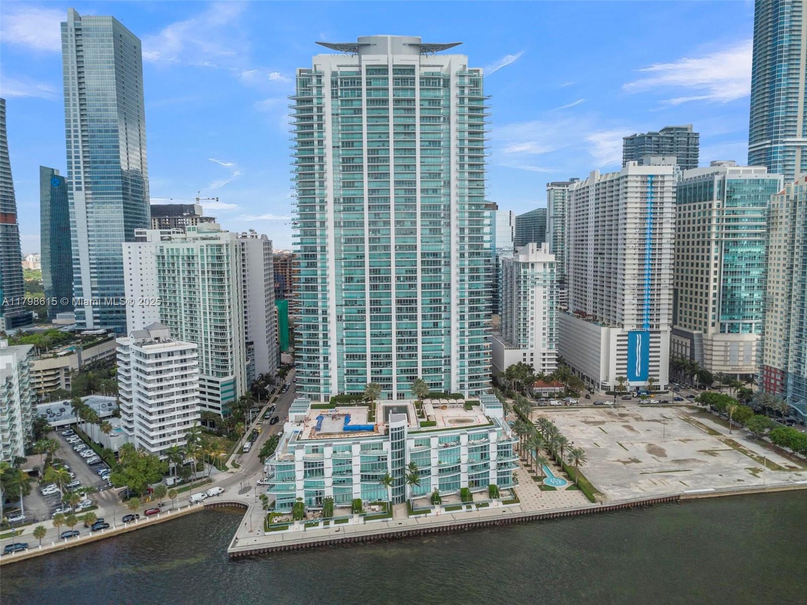 Experience luxury living at Jade at Brickell in this spacious 2-bedroom, 2-bath residence with 1,460 sq ft of elegant interiors and large balconies perfect for indoor-outdoor living. Enjoy private elevator access, marble and wood floors, and marble bathrooms. This exclusive waterfront condo offers stunning bay views and world-class amenities including 24-hr security, concierge, infinity-edge pool, fitness center, business center, and valet. Located in the heart of Brickell, steps from restaurants, Mary Brickell Village, Downtown, and top financial centers. Minutes to the airport, Coral Gables, Coconut Grove, and South Beach.