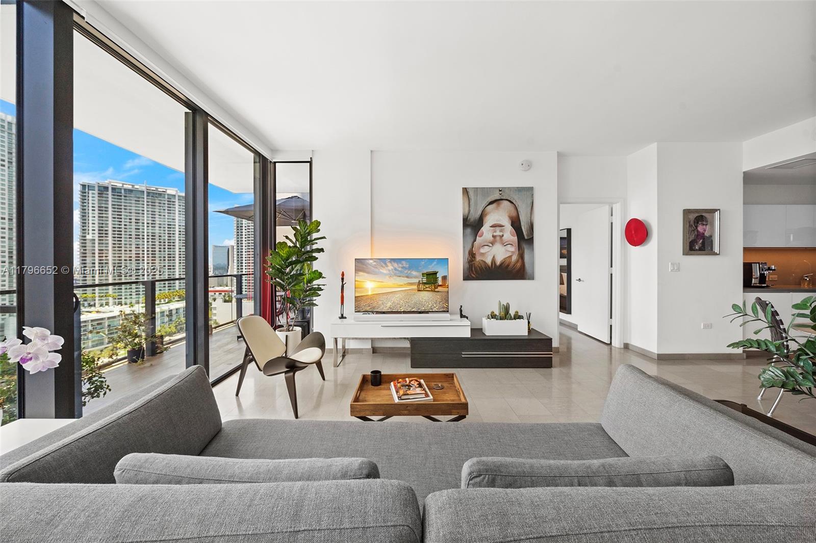 Step into the largest and most spacious one-bedroom condo of Reach Tower at Brickell City Centre! This condo offers breathtaking river and skyline views. Fall in love with the elegance of natural stone floors throughout along with modern floor-to-ceiling sliding impact glass doors that fill the space with natural light. Enjoy your Italkraft kitchen, stone counters and premium Bosch appliance package. In the bedroom, delight in your custom California Closet installed by the current owner that provides ample and well-planned storage, and take comfort in dual sinks in the primary bathroom. With an extra powder room for guests and luxurious finishes, this condo is the perfect blend of comfort and elegance!