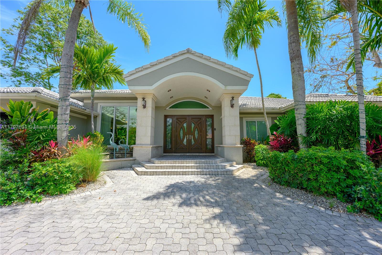 This completely remodeled gem offers the perfect blend of luxury and tranquility. With an expansive living space, this residence features 5 spacious bedrooms and 4 beautifully appointed bathrooms and office. 
Open floor plan that seamlessly connects the living areas. The modern kitchen is a chef's delight, equipped with top-of-the-line appliances and stylish finishes. 
Step outside to discover your private oasis, complete with a sparkling pool and breathtaking views. Situated on a generous lot of over 15,000 square feet, the outdoor space is perfect for hosting gatherings or enjoying serene moments by the water. Nestled on a quiet cul-de-sac, this home also boasts a 3-car garage, providing ample space for vehicles. Walking distance to Coral Reef Park.