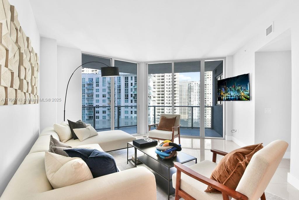 This modern 2-bedroom, 2-bathroom condo offers the perfect blend of comfort, style, and convenience. Located in the heart of Brickell, this unit features a spacious open floor plan with floor-to-ceiling windows that flood the space with natural light and showcase breathtaking views of the city skyline.The sleek kitchen is equipped with modern cabinetry, stainless steel appliances, and ample counter space. The primary bedroom features generous closet space and a beautifully updated en-suite bathroom. A full-sized washer and dryer are conveniently located in-unit. Enjoy access to resort-style amenities (building amenities can be listed here if known – pool, gym, concierge, etc.) and live just steps away from world-class dining, shopping, nightlife, and public transportation.