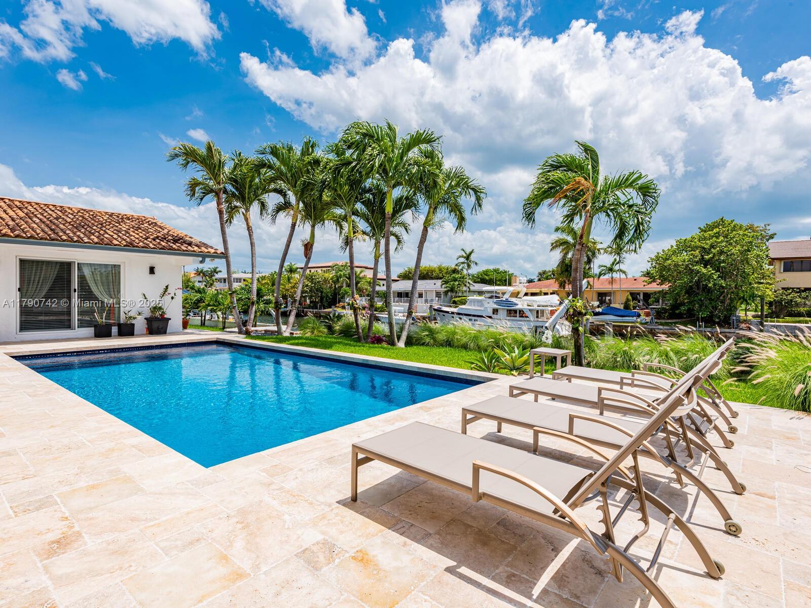 Tropical modern 6BD 6.1BA fully furnished short term direct ocean access luxury rental in Gables by the Sea. 1-story updated open, spacious floor plan w/3085sf liv area on 11,500 sf waterfront lot. Travertine & tile floors, full impact glass, saline beach entry pool & covered patio. Fully equipped chef's kitchen w/top appliances. Contemporary coastal living w/private dock, 1min to Biscayne Bay w/no bridges. Gables by the Sea is a guard-gated, family-friendly community: park w/playground, top tier schools, 20 mph closed-end, low traffic pedestrian-friendly streets. The City of Coral Gables, an Int'l Sister City boasts significant landmarks, 1st class services, parks, restaurants, shops & theaters. Cosmopolitan vibe within a safe community setting. Available Sept 1st including all utilities.