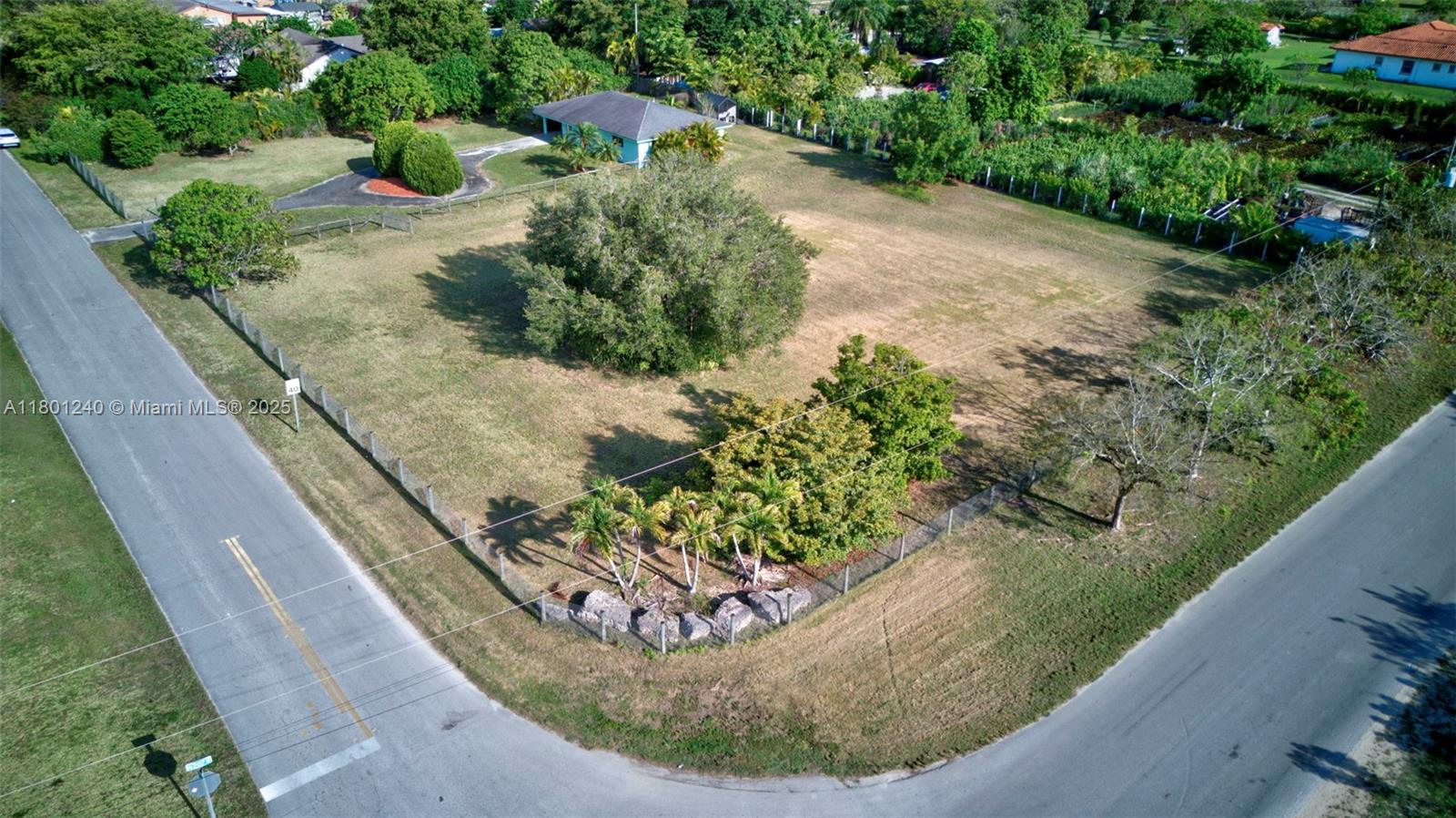 Welcome to this charming, one-story, 2-bedroom, 2-bathroom home in the sought-after Redlands area! Built in 2020, this residence offers a fresh canvas, ready for your personal touch. Situated on a spacious corner lot, it's perfect for building your dream home, horse stall, or creating the ideal ranch retreat. The property features new impact doors and windows, a large shed, and expansive land surrounded by mature fruit trees. Fully fenced for privacy and security, this home is all about embracing the tranquil ranch lifestyle.