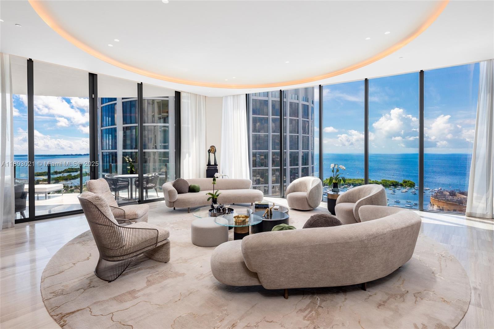 Welcome to luxury living at Park Grove! This nearly 6,500 sqft high-rise rivals penthouses, offering breathtaking 270° ocean and skyline views. Crafted with $3M+ in custom millwork, programmable lighting, and exquisite finishes by Deborah Wecselman. Features include five bedrooms, five bathrooms, two half baths, his and her offices, and extensive built-ins. Enjoy an oversized storage unit and three parking spaces, all right next to the elevator. Expansive 12 foot floor-to-ceiling windows and 835 sq. ft. of outdoor space create an inviting atmosphere. The 750+ bottle wine cellar with temperature and humidity control is a connoisseur’s dream. Amenities include a gym, screening room, billiards room, valet, and more. This unit blends elegance, tech, and design for the ultimate Miami lifestyle.