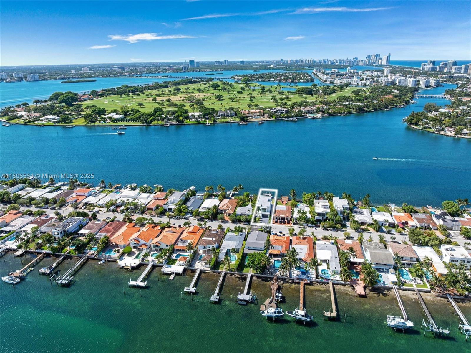 Exceptional new construction waterfront residence in a prestigious gated community with ocean access and bay views. This 5BD/5.5BA two-story home features a bright, open layout with floor-to-ceiling windows for natural light. The chef’s kitchen includes custom cabinetry, granite countertops, Thermador and Miele appliances, wine cooler, and mini fridges. The expansive primary suite offers a private terrace, dual walk-in closets with custom built-ins, and a spa-style bath with dual sinks, soaking tub, and shower. All other bedrooms are ensuite with built-in closets; one has a private terrace. Enjoy indoor-outdoor living with a heated saltwater pool, spacious patio, and private dock. Additional highlights include a 2-car garage, ample driveway parking, and elevated finishes.