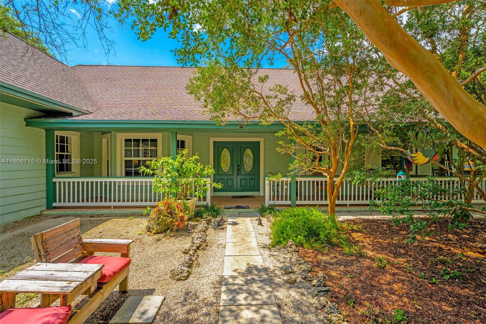 COZY 3/3 FARMHOUSE ON 1.1 ACRE IN REDLAND. THIS GEM IS FULL OF SOUTHREN CHARM. THE MINUTE YOU WALK IN THE DOOR YOU ARE WELCOMED BY PINE VAULTED CEILINGS W/ AN OPEN FLOORPLAN. THE LIVING ROOM HAS VIEWS OF LARGE BACK COVERED PATIO & LOFT. THE KITCHEN IS A CHEF'S DREAM WITH A GAS STOVE/HOOD VENTED SYSTEM & FRENCH COUNTRY CUSTOM WOOD CABINETS. THERE ARE 2 LARGE BEDROOM SUITES, W AN ADDITIONAL BEDROOM DOWNSTAIRS. UPSTAIRS IS THE LOFT OVERLOOKING THE FLOOR PLAN. THE GROUNDS ARE IMPECCABLE, LOCATED IN REDLAND, MIAMI'S AGRICULTURAL DISTRICT.  THE HOME BOASTS FLORIDA NATIVE SPECIMEN PLANTS, WELL (NO WATER BILLS), SEPTIC, FLOOD ZONE X (NO FLOOD REQUIRED), NO ASSOCATION, MEANDERING PATHWAYS WITHIN WALKING DISTANCE TO SCHOOLS & CINNAMON ROLL PLACE. SHE'S A BEAUTY. MOWER INCLUDED