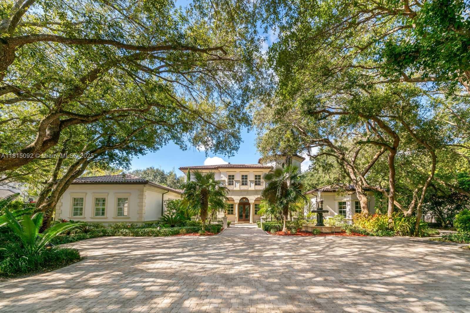 This stunning 2-story custom resort-style estate sits on 1.15 acres in one of Pinecrest’s most desired neighborhoods. Through the gates, you’re greeted by a charming fountain, meticulously manicured landscaping, & majestic oak trees. The interior boasts elegant marble & wood flooring throughout. Spacious kitchen equipped with top-of-the-line appliances, offering both functionality & style. The ground-level Master Suite offers a luxurious retreat, w/ a sitting room, dual closets, a massage room, & a secluded terrace. Notable amenities include a gym, game room, sauna, dual maids’ quarters, smart home technology, a sound system, & a 3-car garage w up to 6 Car Garage. The resort-style backyard fts. pool, jacuzzi, summer kitchen, & ample space to entertain. Near Pinecrest’s top schools.