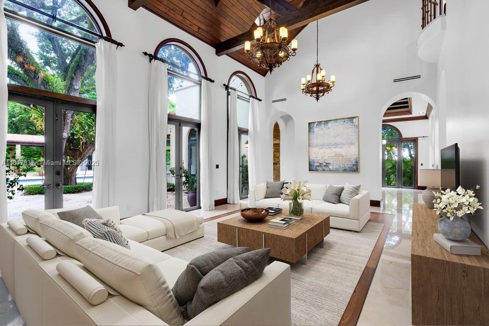 Step into timeless elegance with this stunning Mediterranean estate in coveted Pinecrest. Nestled on a beautifully landscaped, oversized lot, this 9-bed, 9.5 bath residence offers over 9,000 sq ft of refined living space, including two private guest houses. A grand oak-framed entrance leads to an elegant two-story layout with marble and wood floors, a chef's kitchen with top-tier appliances, a luxurious primary suite, a media room, a wine cellar, an elevator, and staff quarters. Enjoy resort-style outdoor living with a large pool, a jacuzzi, garden views, and a 4-car garage. Located in a top school district, this estate blends sophistication, privacy, and modern comfort.

Twenty-four hours in advance is required.
