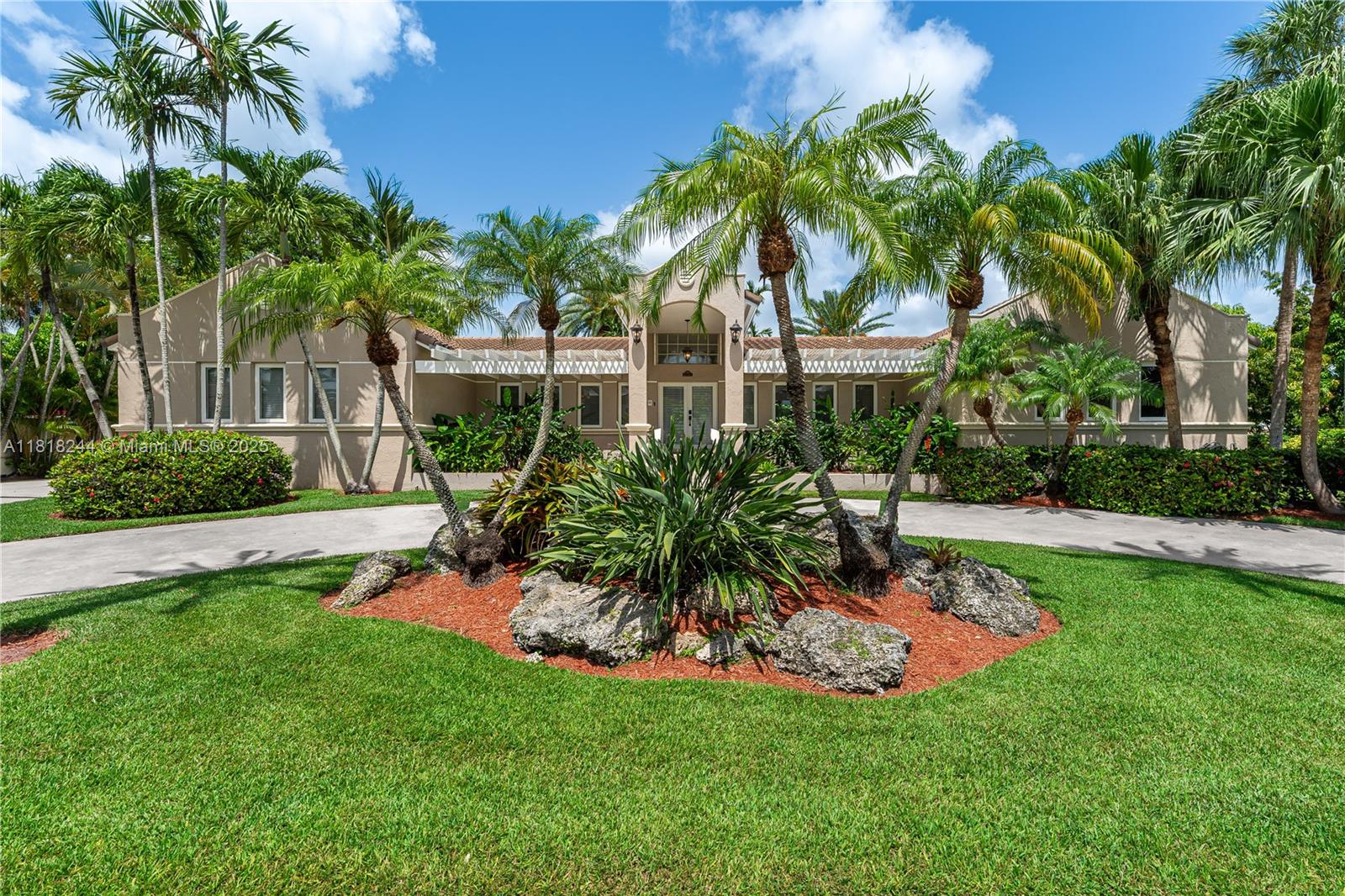 Palmetto Bay 5BD/4BA/2CG luxury waterfront pool home, architect-owned with impeccable craftsmanship & solid structure. A grandiose front entrance welcomes you into a bright, open layout w/ oversized formal LR & elegant DR—perfect for entertaining. Chef’s dream eat-in kitchen boasts gas stove, 2 convection ovens, top-tier SS appliances, custom oversized counters & granite. Step outside & enjoy peaceful wide canal views, no rear neighbors on 16,859 SF lot w/ lush landscaping, circular drive & basketball court. 2022 roof +warranty, impact windows & doors, 4,324 SF under A/C incl. garage with 5,198 total SF. Generous master suite with Jacuzzi hot tub, abundant storage, indoor laundry, freshly painted. Prime location near Deering Estate, Sadowski Park & top schools. Fall in love at first sight!