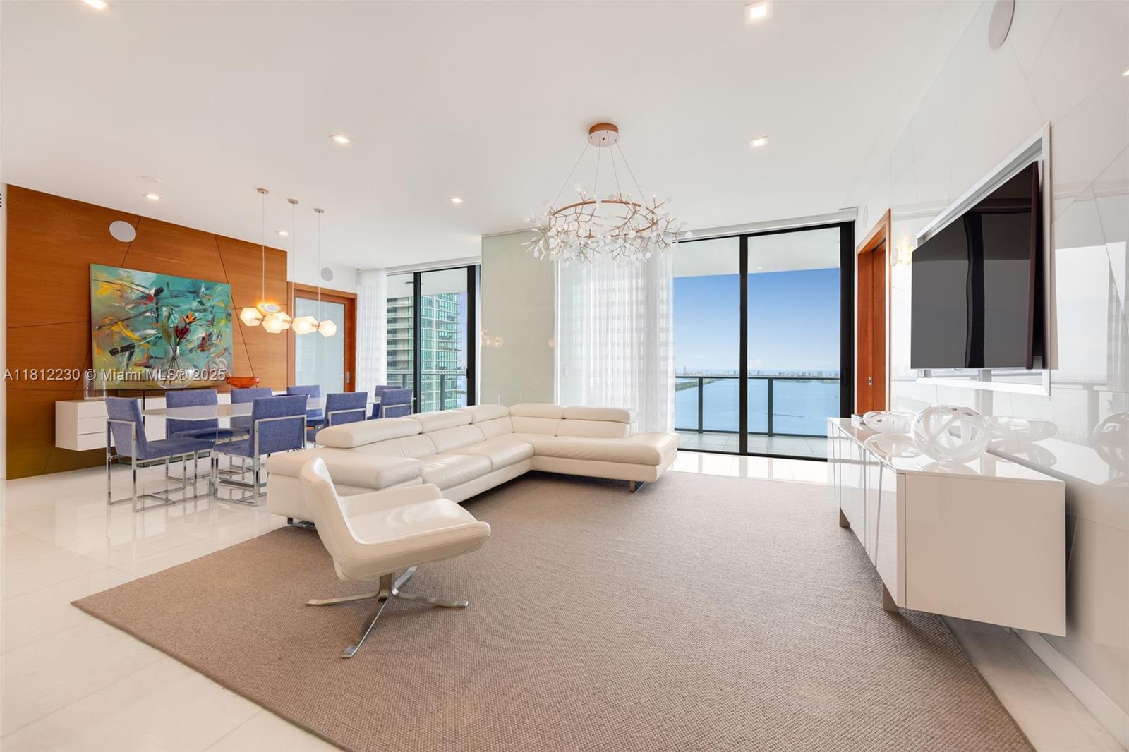 Rare opportunity to own a customized 3BD/3.5BA, 2,147 sq ft residence at Gran Paraiso—created by combining two units for a unique layout and a stunning 425 sq ft balcony with direct water views. Designed by J Design Group, it features smart home tech, high-end appliances, smart toilets and designer furnishings (negotiable). Enjoy resort-style amenities: tennis courts, spa, gym, pool, kids’ area, concierge & valet. Prime Miami location near Port, Beaches, galleries & dining. HOA: $1,280 & Master Association: $1,975.