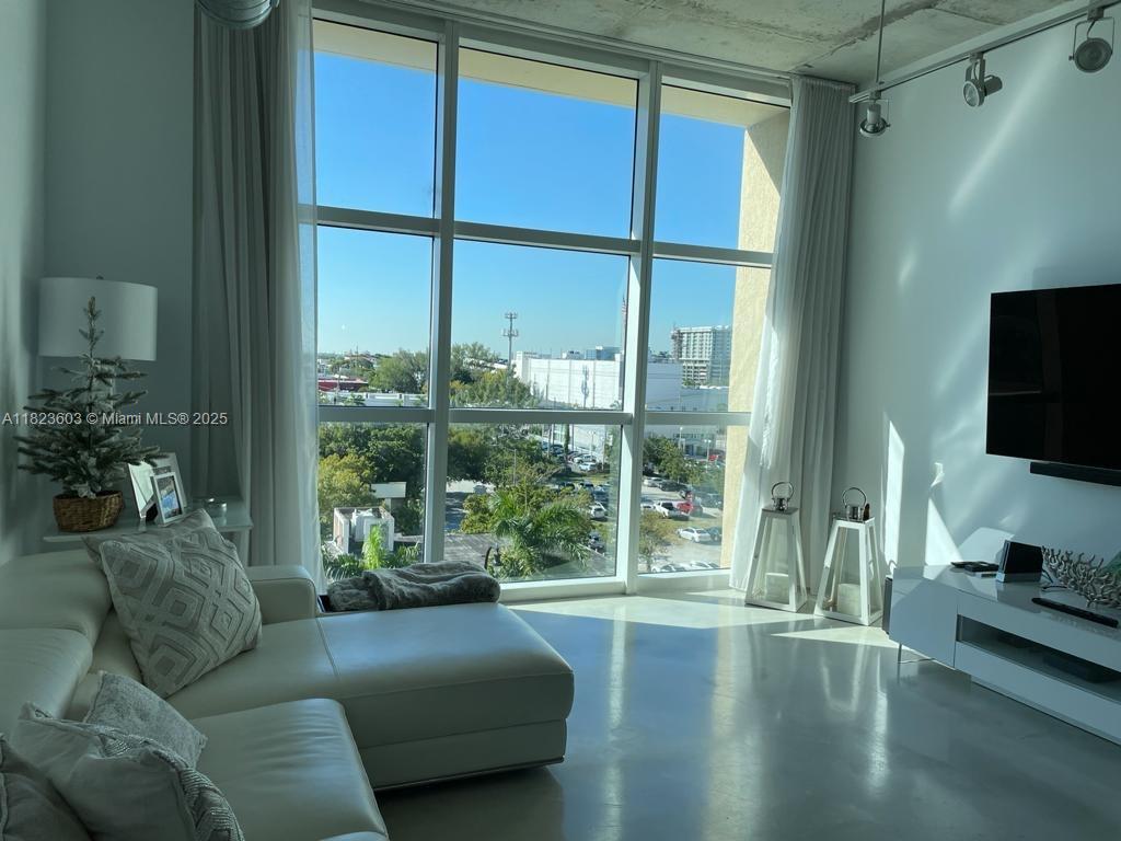 Amazing NY-loft-style condo showcases ductwork, polished concrete floors and soaring 11ft concrete ceilings, centrally located in the heart of Miami, comfortable kitchen w/kitchen island, stainless appliances, marble in all the bathroom, impact windows, with city views. Cite is a full-service condo offering 24/7 front desk, valet and security. Club room w/pool billiard, business lounge w/free internet 24/7. Walk to shopping & dining. Great location in trendy East Edgewater on the bay & by the park. Close proximity to Wynwood, Design District, Midtown, Downtown, all major highways, beaches, airport & hospitals. Cite offers resort style pool & jacuzzi, fabulous fitness center. Located across from Park offering tennis, volleyball, basketball.