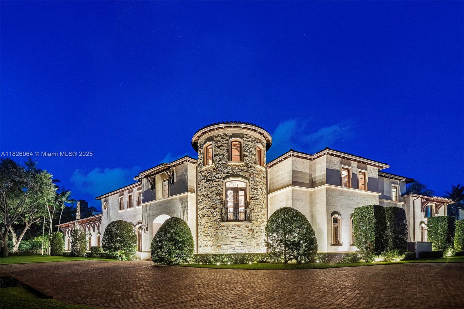 In coveted Suburban Dr, North Pinecrest, designed by renowned architect Ramon Pacheco, discover “The Art of Living Well.” This timeless 7-bed, 6-bath, 3-powder room estate masterfully blends nature and sophistication on a 47,196 SF lot with 11,493 SF under air. Anchoring the home is a breathtaking 1,957 SF Grand Lodge Room with a full wet bar and wine room, leading to a chef’s kitchen. Luxurious primary suite with private terrace and morning kitchen. Additional features include a soundproof media room, commercial-grade elevator, 3-car garage with 7-car capacity via Italian lifts, and a 2-bed, 1-bath guest house. A redesigned breezeway connects to resort-style amenities, offering seamless indoor outdoor living in an exceptional, enduring retreat