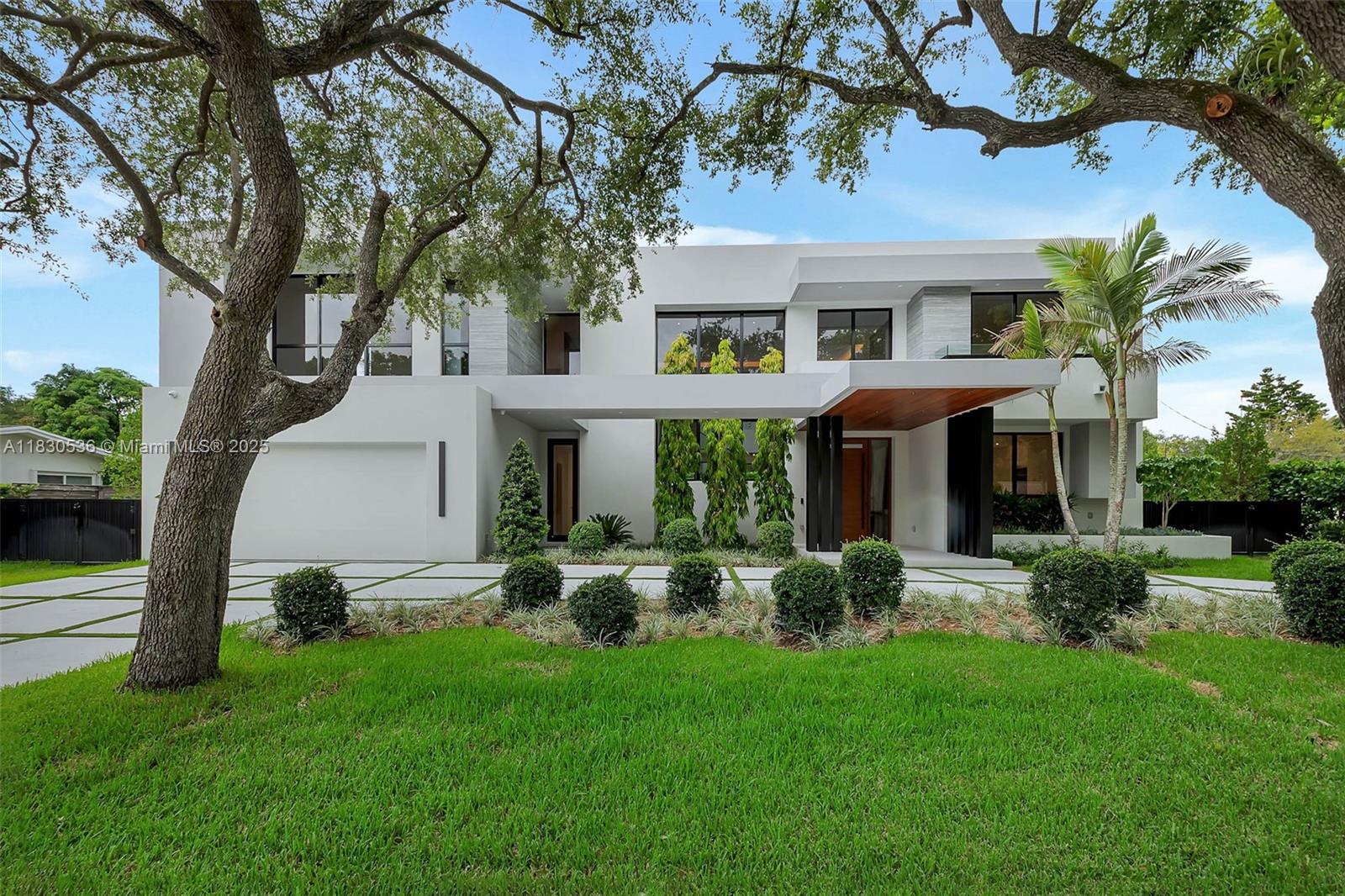 Stunning new construction located in Pinecrest.  Experience modern luxury living in this beautifully designed open floor plan home that features a two-story living and dining room with beautiful custom glass railings and woodwork. This home has 6 bedrooms plus a den.  The kitchen features high-end appliances, dual wine cooler and a walk-in pantry.  Seamless in and outdoor living with expansive outdoor space, covered terrace and summer kitchen make this home perfect for South Florida living. Fully equipped smart home with multi zone speakers, light switches and alarm. This home also includes an elevator, and is electric car charger and generator ready. Every detail was thought of in this home.