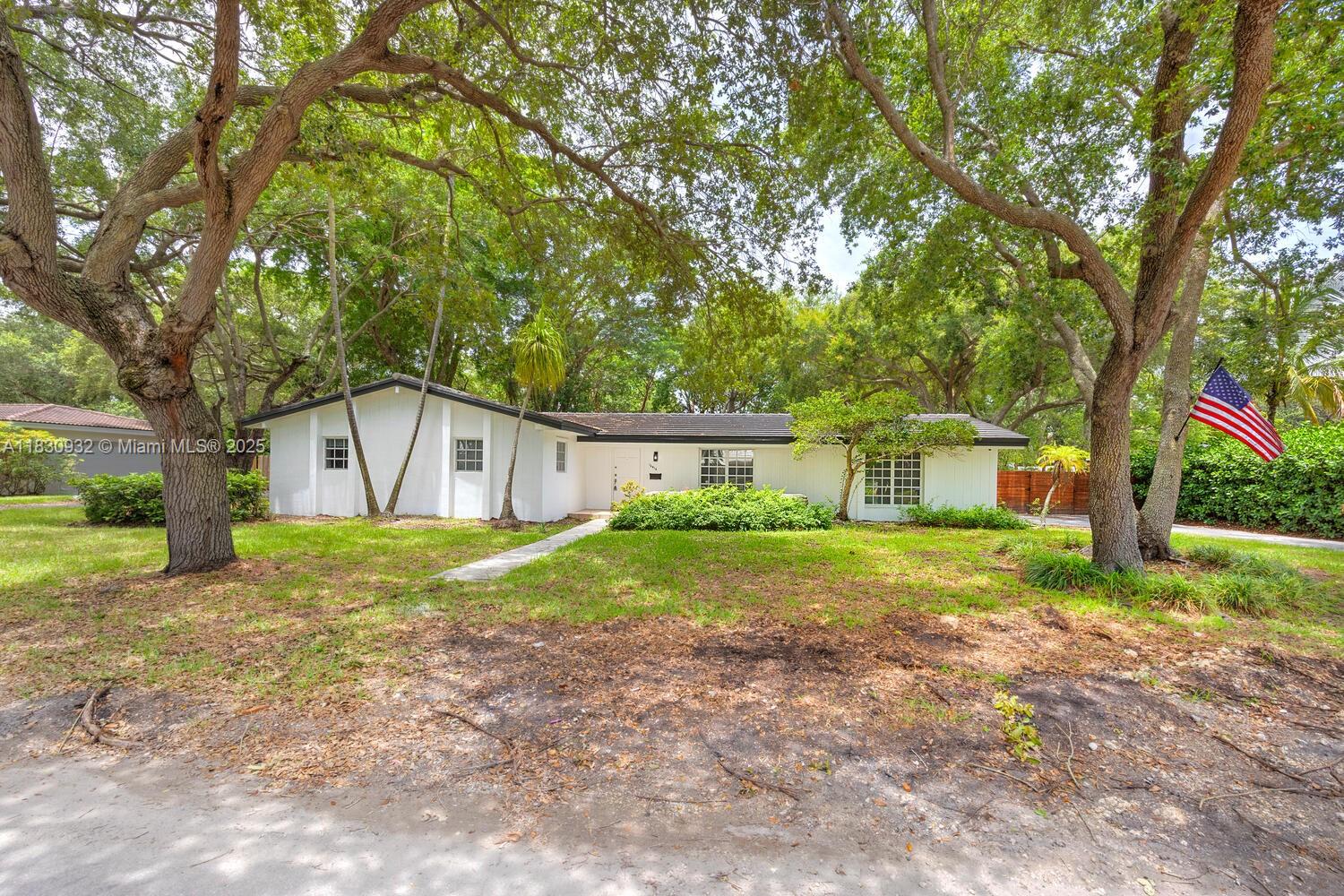 Situated on a 16,739 sq ft lot shaded by oak trees, this charming 3BD/2BA home sits on a quiet, tree-lined street in one of Palmetto Bay’s most desirable neighborhoods. Features include formal living and dining rooms, a spacious family room with coral rock accents, and French doors leading to a large backyard—ideal for relaxing or entertaining. The primary suite offers a walk-in closet and private bath. The fenced yard has room for a pool or expansion. Located near top-rated schools, Deering Estate, Coral Reef Park, and local shops. Enjoy a vibrant community known for block parties, “Santa’s runway,” and Halloween fun. Perfect for families or anyone looking to downsize without compromise. Space for a boat or RV.