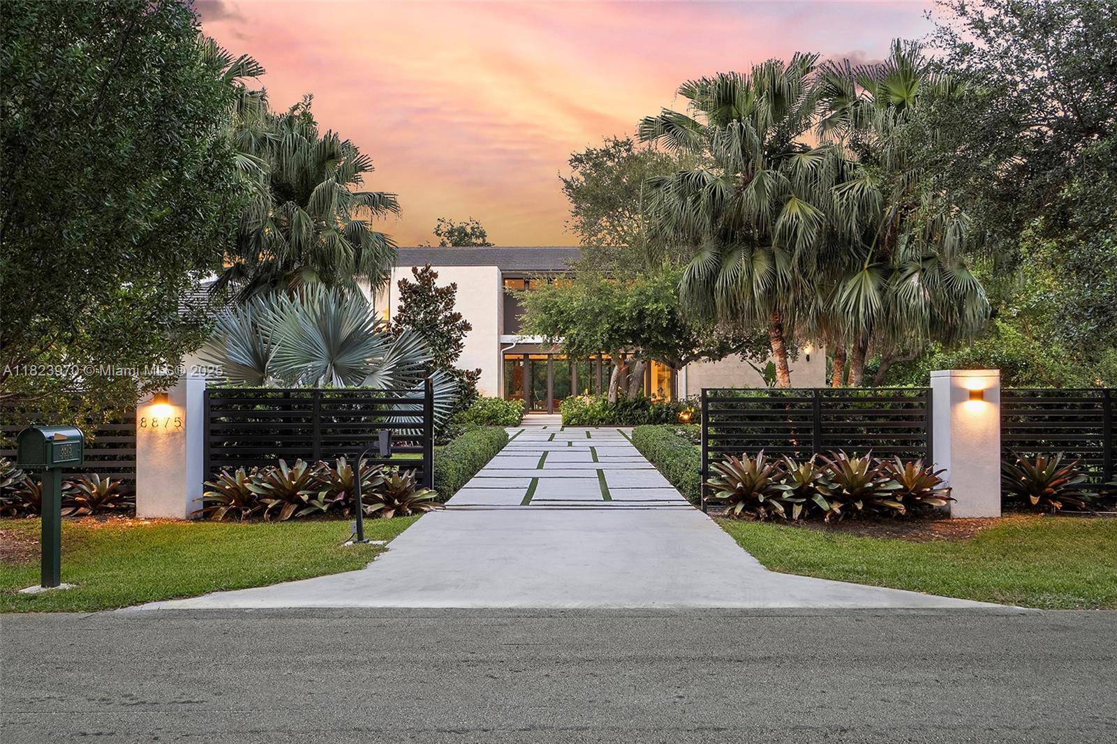 Welcome to Casa Paraíso – Immerse yourself in the most exclusive North Pinecrest lifestyle. This 2022 modern masterpiece sits on a full acre with 7,184 SF under A/C and 11,651 SF total. Enter through private gates and a long driveway to a stunning glass façade with soaring ceilings, rich wood millwork, and lush custom landscaping. The ideal layout offers 3 bedrooms on the first floor, formal living with fireplace, formal dining, Italian kitchen with Subzero/Wolf appliances, walk-in pantry, family room, service quarters, laundry, and elevator. Upstairs: primary suite with oversized closet, 3 bedrooms, den, and second laundry. Outdoors: resort-style pool/spa, covered terrace, oversized gazebo with summer kitchen, and room for a tennis court. Next to Miami’s best schools.