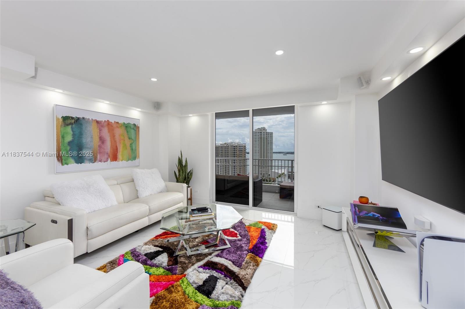 Completely Redesigned & Remodeled 2 Bedroom 2 Bath with Bay Views and Amazing upgrades & Custom built-ins!  Beautiful extra large white porcelain tiles throughout, Open Kitchen with Samsung Stainless Steel appliances, LG Full Size washer & dryer, White Italian cabinets and Elegant Carrera Counters!  Beautifully updated bathrooms!  Huge California Walk-In Closets!  LED Recessed lighting throught the apartment!  Large Balcony for awesome entertaining!  Come to Brickell Key...your Island Oasis...and move right into this 100% turn-key apartment and start enjoying the Island Life!  Elegance + Sophistication is what you will get in this Chic, Ultra Modern 2/2 that epitomizes the Coolness & Glamour of Miami's Brickell neighborhood!

VACANT & EASY TO SHOW ANYTIME!   CALL LISTING AGENT CARLOS!