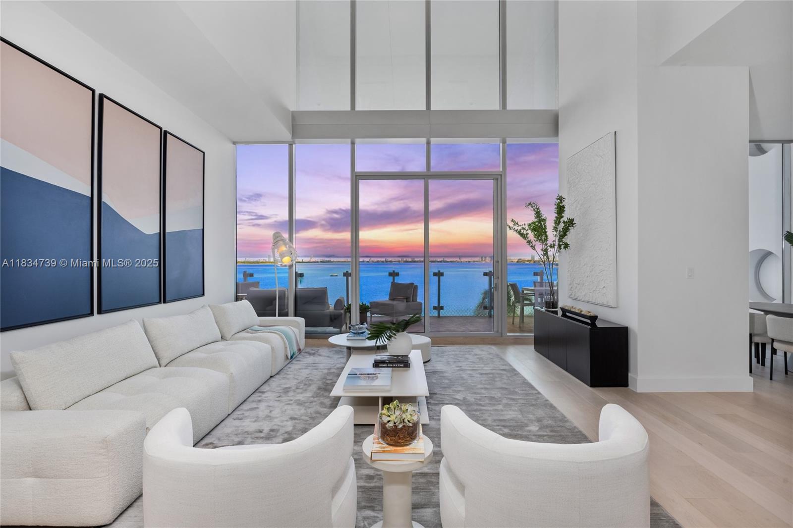 Rare 6-bedroom, 6.5-bath, 4,345 SF 2-story townhouse in the iconic Missoni Baia. This waterfront residence offers a private foyer, European White Oak flooring, and soaring double-height ceilings with floor-to-ceiling windows that frame direct Biscayne Bay views. The expansive living space includes large walls ideal for displaying an art collection. The chef's kitchen offers Sub-Zero and Wolf appliances, Italkraft cabinetry, and marble counters. The spacious primary suite features a wet bar, sprawling walk-in closet, oversized soaking tub, dual bathrooms, spa-style showers, and double vanities. Enjoy resort-level amenities: pools, a fitness center, spa, sauna, tennis court, kid’s playroom, valet, concierge, and 24/7 security. Located near the Design District, Brickell, and South Beach.
