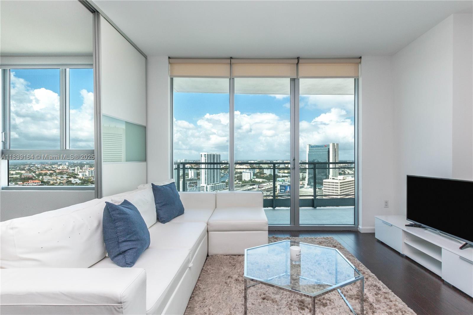 Experience vibrant city living in this beautifully appointed corner residence at The Ivy, just steps from Brickell City Centre, world-class dining, shopping, and entertainment, as well as the Metromover. This light-filled unit features floor-to-ceiling windows, warm wood flooring, and an open-concept layout with a sleek sliding door that offers privacy between the living and bedroom areas. The modern kitchen boasts granite countertops and stainless steel appliances, while a convenient in-unit washer and dryer and an assigned parking space add everyday ease.
Located within a private, gated riverfront community, The Ivy offers premium amenities including 24-hour concierge and security, a resort-style pool, a fully equipped gym, spa, game room and a children's playground.