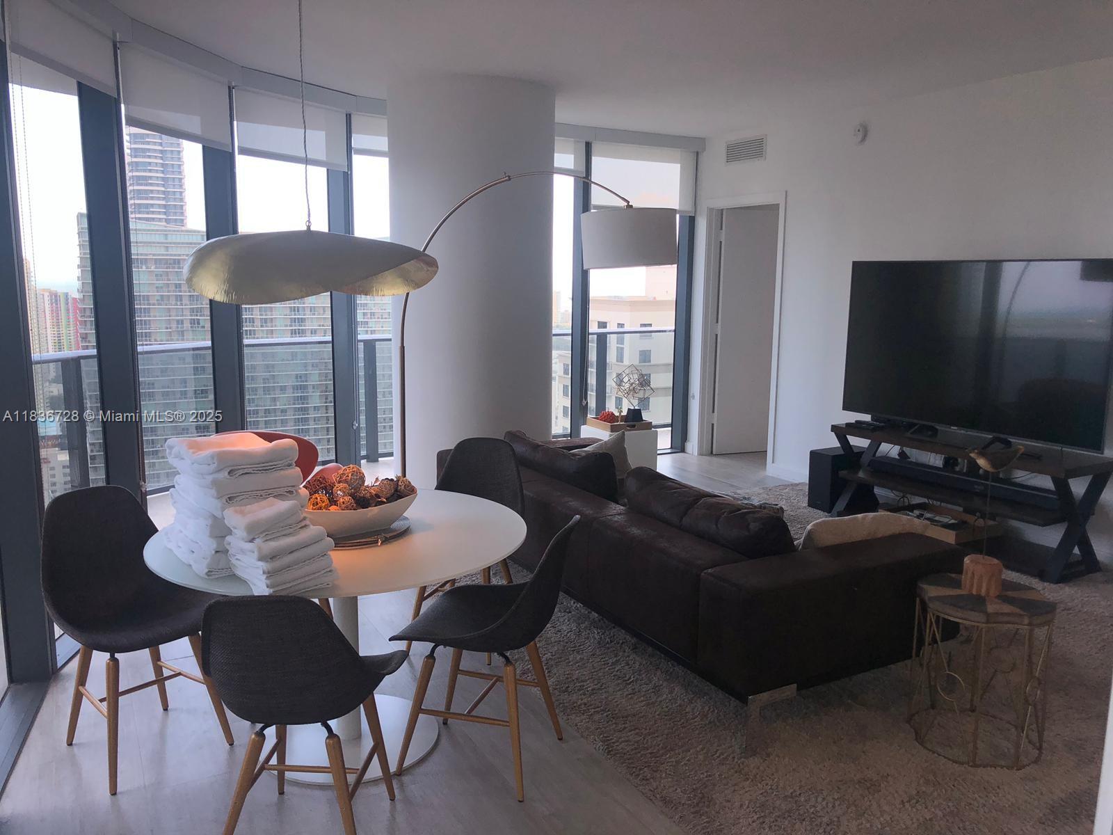 Spectacular 2BD/2BA unit with wraparound balcony. 2 beds/2 baths with stunning panoramic views of Brickell Skyline and partial water views. Top of the line finishes, quartz countertop, tile floor throughout, double sink in the master bathroom, washer & dryer. Amenities include a 9th-floor oversized pool, two party rooms, kidsplayground room, conference room, theater room, full gym with spa and roof-top pool in each tower. Soul Cycle and Equinox Gym and Spa in the building. Across the street from Brickell City Centre and steps away from MaryBrickell Village. EASY TO SHOW!