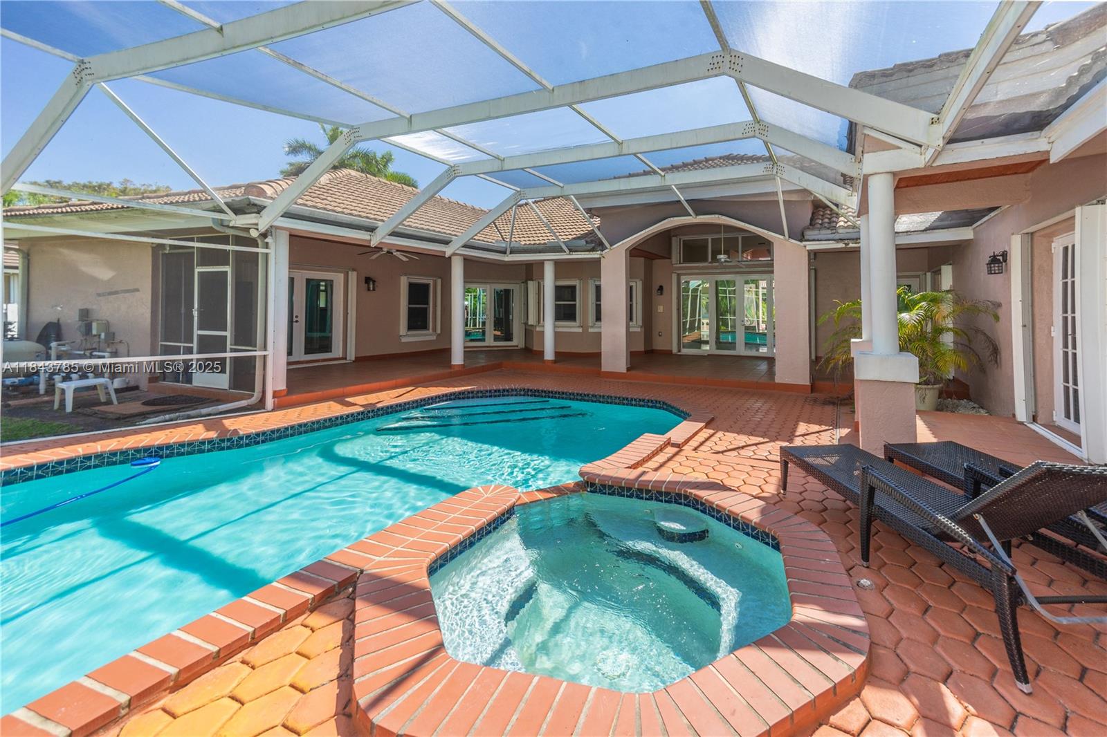 Spacious 5 bedroom, 4 bath home available for immediate occupancy. Double doors open to a welcoming foyer with beautiful views of the pool from the formal living room. The chef’s kitchen is equipped with stainless steel appliances, a center island, walk in pantry and breakfast nook. Just off the kitchen, a large family room with a fireplace offers the perfect space to relax or entertain. The primary suite offers a private retreat with a sitting area, his & hers closets and a spa style bathroom featuring a soaking tub, shower and dual vanities. Step outside to enjoy the fully fenced backyard oasis with a covered patio, screened-in pool, and heated spa. Ideal for year round enjoyment. Located near Deering Estate, this home offers comfort, space, and the best of Palmetto Bay living.