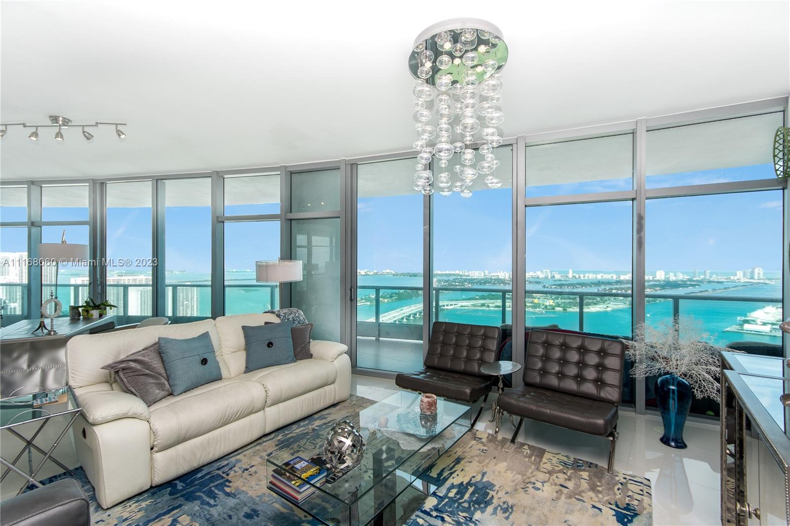 Unobstructed NE Biscayne Bay & city views overlooking Performing Arts Center. HIGH FLOOR HUGE 3 bedroom, 4 bath Corner unit with 24 x 24 white porcelain flooring throughout the unit and terraces. Kitchen W/ Carrara Marble counter tops, Dark Wenge Italian cabinetry, Miele and SubZero Ref. Private elevator & Foyer plus separate service entrance. 10' ceilings. Amenities include 2 pools overlooking the bay, gym, spa, private movie theater, kidz room, 24 hr security, concierge.