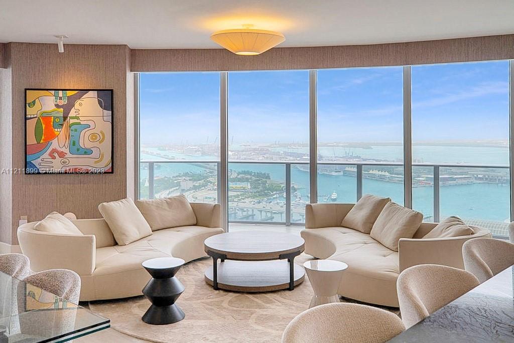 UPDATE: Building litigation settled, and no special assessments. Best value in the building and comparable condos! 3 Bed + Den | 4 Bath with luxurious upgrades! Larger than tax roll (2,365 Sq.Ft. Interior, see floorplan). Enjoy unobstructed panoramic views of Miami Beach, Biscayne Bay, Brickell, and Downtown Miami.  No expense spared, no detail overlooked! Upgrades include: LUALDI ITALIAN DOORS by Piero Lissoni. Custom kitchen (not developer's), mini-bar area, Sub-Zero refrigerator and freezer drawers, 2 Sub-Zero wine coolers. Wired-in electric window treatments, California closets, Master Bath: custom vanity, Paris Mirrors with LED lighting, TOTO NEOREST Toilets. High-End Furniture negotiable: Roche Bobois, Minotti and more. Building allows min. 6 month rentals.