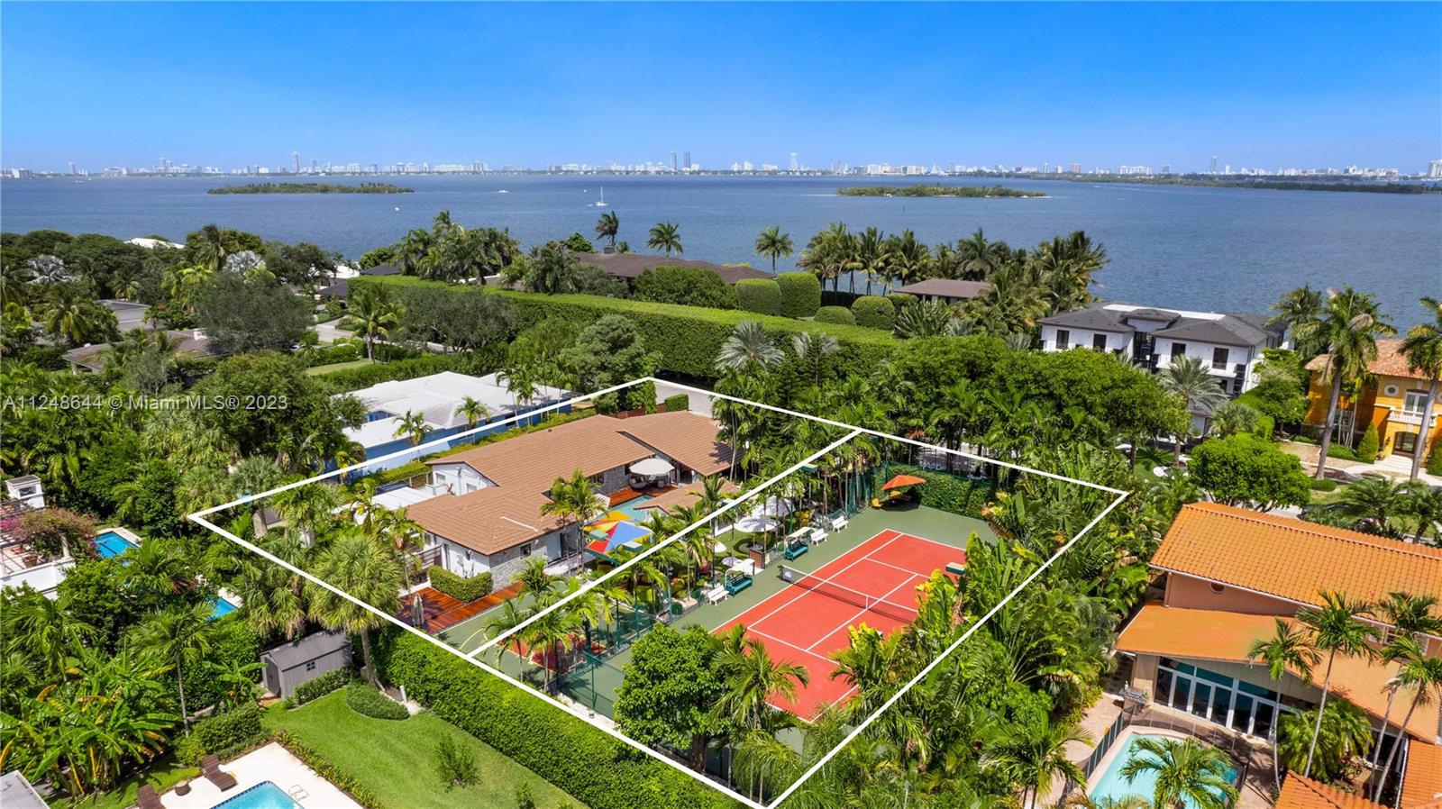 TWO LOTS! Unique opportunity to own two contiguous lot perfect to build two homes in the most premium location in the island of Bay Point.  CASA CLUB. Enjoy this tropical paradise perfect to live and entertain at the exclusive island of Bay Point, the only true gated private community in the east of Miami with the most amazing outdoor living with your private Tennis court, basketball court, mini golf, billiard room, and gym in this charming double lot, fully renovated, 5 bedroom, 4 bathroom, modern ranch home. All new: roof, impact windows, modern kitchen with stainless steel appliances.  Guest quarter with morning bar and gym. Just 10 min from Miami Beach and MIA. Next to Design District, Midtown, Wynwood. Private financing available.