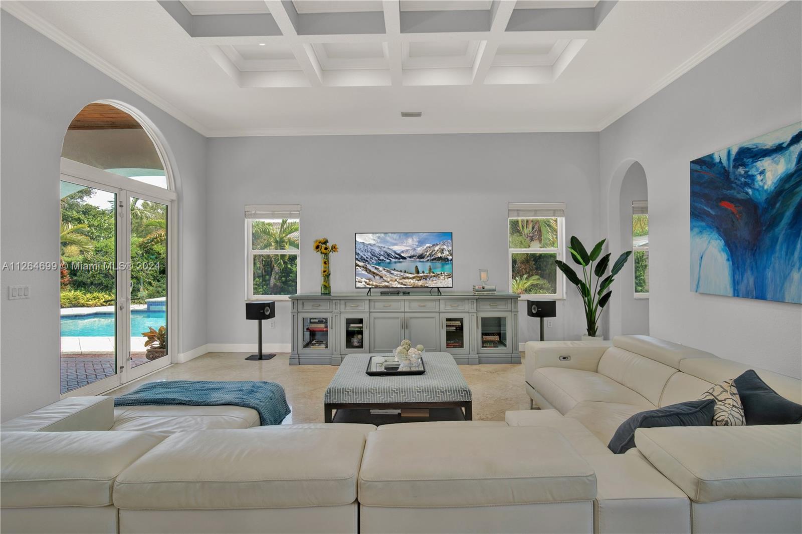 Gorgeous Family Room Boasts Pool, Garden and Patio Views