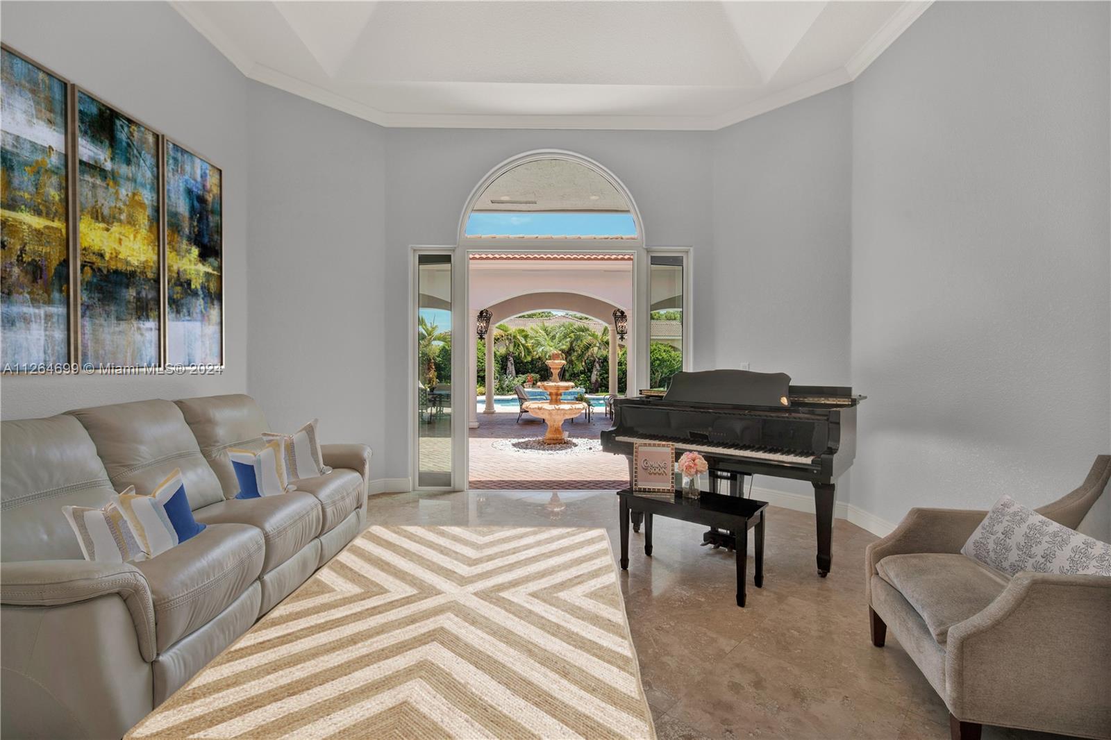 Living Room Boasts a Lovely Fountain Focal-Piece and Great Patio Views!