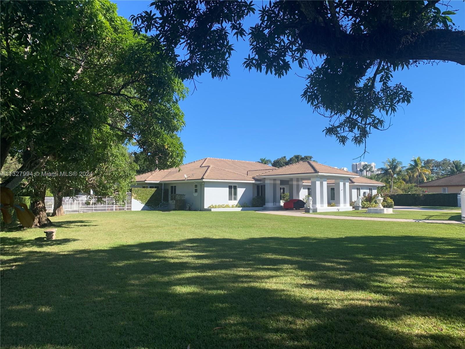 NEW ROOF 2024. On a builder's acre. 4,785 liv sq ft/6,280 under roof(appraiser sketch). Only home at end of  cul-de-sac/1 of 4 on the block, walled/2 gates, 4-zone A/C(2015-22) painted in '22, complete marble floor('13)NEW kitchen/Miele('13), complete impact windows/doors/solar reflective('21), 36kw Generac quiet generator/1,000 gallon tank('14), volume ceilings, '44 heated lap pool/pool deck('14), summer kitchen w/Viking stove('16) 2-car garage, car port, plus awning car port, no hurricane evac. for cat 1-3/'95 post Andrew build code, not in flood zone, close to 3 highways, high rated schools. Attic storage, LED lights('15), bath(2013). Ca.closets('12), tank/tankless water heaters. 3 spas. Exer./Game room. Formal liv./din.rooms. Fruit trees. NO HOA(OWNER FINANCING)(ALSO LISTED FOR​​‌​​​​‌​​‌‌​‌‌‌​​‌‌​‌‌‌​​‌‌​‌‌‌ RENT)