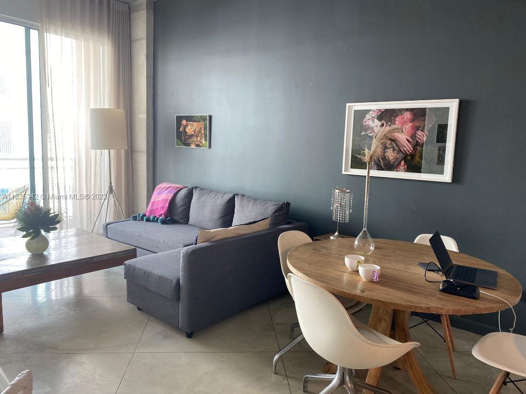 glass sliding doors leading to the balcony