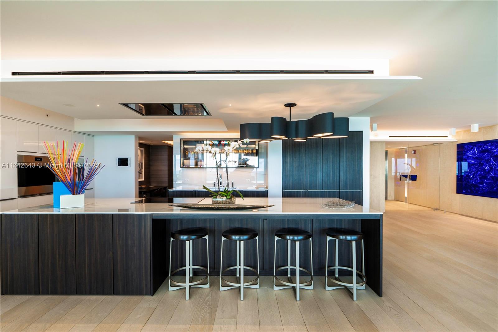 Gorgeous kitchen with cooking island, & top-of-the-line Wolf, Subzero, & Meile appliances.