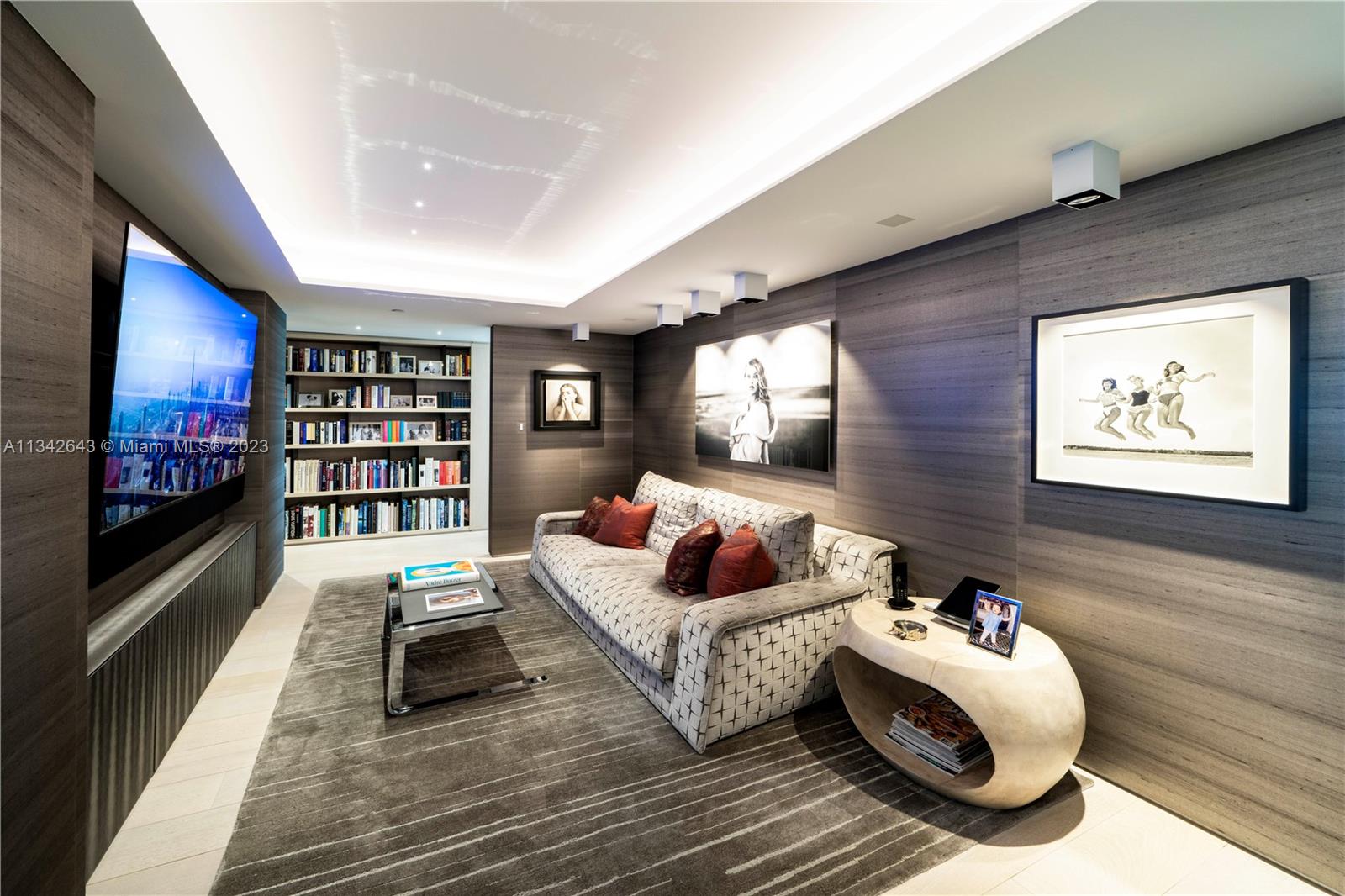 Den with wet bar & wine storage.