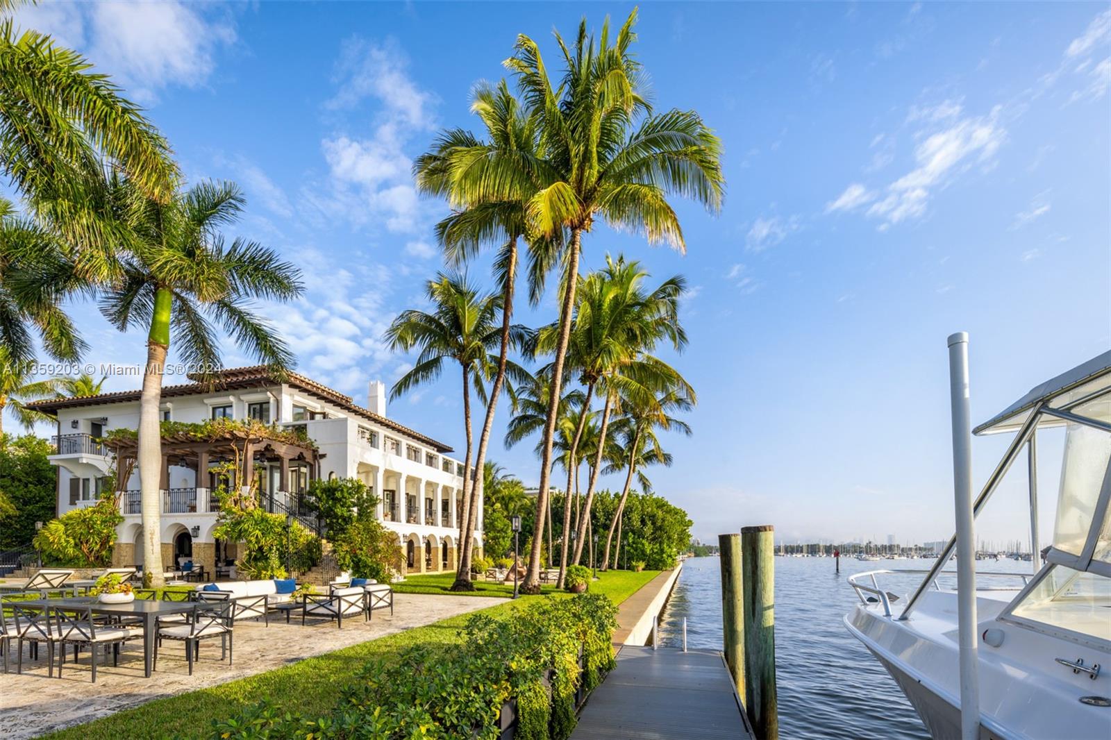 Perfectly set on a ½ acre +, bayfront estate, this 3-story Villa is the epitome of sophisticated Miami living. Step into the atrium boasting 30’ ceilings, Jerusalem stone staircase where you are greeted by unobstructed panoramic water views of the Miami skyline.From the mahogany floors to the 40’ dock, every attention to detail is reflected in this estate’s craftsmanship. Enjoy views of Biscayne Bay from the grand room or the open terrace, ideal for outdoor entertaining while overlooking the pool & 300’ of open bay. 8 beds & 8/1 baths are perfectly spread out over 10,100 sf of area. Located in private, guard-gated & historic community of Camp Biscayne, enjoy tranquility in this estate while being steps away from some of the country’s finest private schools, shops, restaurants, & marinas.