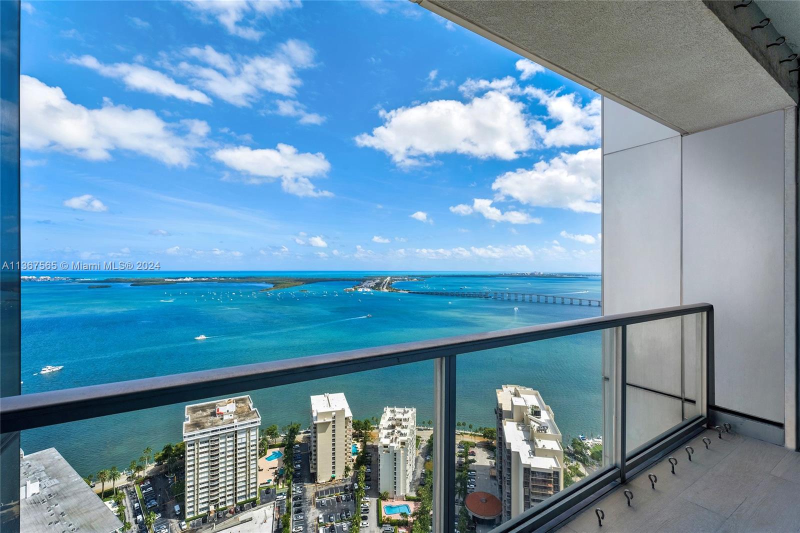 This spectacular newly renovated contemporary corner unit at the exclusive Four Seasons Miami offers 3BR/4+1BA & 3,913 SF of beautifully proportioned interiors w/amazing unobstructed views far as the eye can see over Biscayne Bay, Miami Beach, Atlantic Ocean, Key Biscayne and city. Custom wall papers, millwork, cabinetry, porcelain oak tile floors, designer treatments. Spacious living & dining floor plan surrounded by glass walls w/water views from every angle. Chef’s kitchen w/top-of the-line appliances, Stosa cabinetry, Opustone center island & access to a terrace. Private principal suite offers custom walk-in closet, private terrace & stunning bathroom w/exquisite marble & sunken tub. The other two BRs are each meticulously designed w/en-suite baths. 5-star Four Seasons amenities.