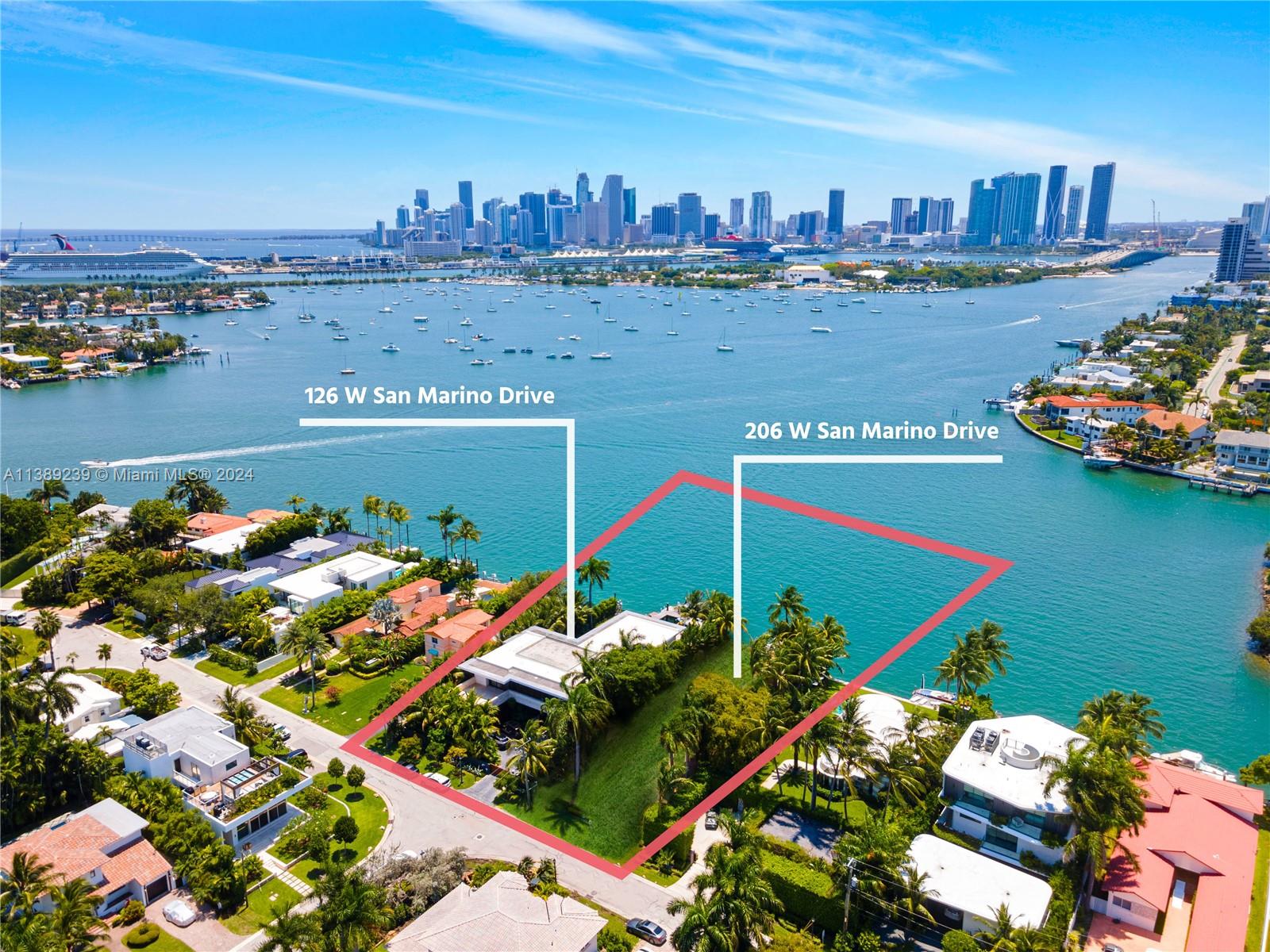 THE ULTIMATE POST CARD VIEW OF DOWNTOWN MIAMI SKYLINE ON THE BAY…EXPAND YOUR COMPOUND WITH THIS TROPICAL MODERN WATERFRONT ESTATE + ADJACENT LOT ON THE BEST LOCATION OF SAN MARINO ISLAND! Stunning Two-Story Waterfront Residence w/ 12,889 Adj Gross SF on 2 AND A HALF LOTS w/ 26,250 SF w/ 150 FT of Waterfront. 10 Bedrooms + 9 Baths + 3 Powder Rooms + Media Room + Office + Family Room. Open Floorplan with 10 FT Telescopic Doors by Fleetwood providing Seamless Indoor/Outdoor Living. Blonde Oak Chef’s Eat-in Kitchen with Stainless Steel Miele Appliances, Breakfast Area + Family Room, Library, Wine Cellar & Bar. Spacious Primary Suite draped by Panoramic Sunsets & Views of Miami Skyline. Tropical Pool & Spa with Modern Gazebo + Summer Kitchen + Cabana Bath. Opportunity for 3 Vessel Dock + Lift.