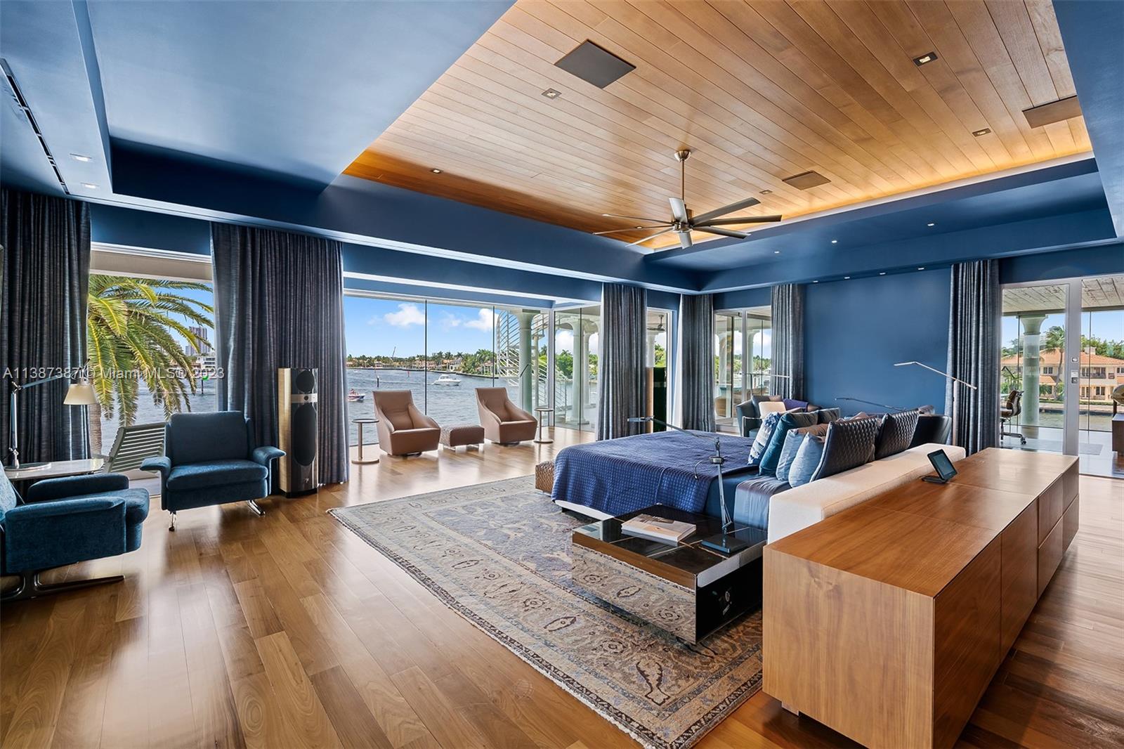 Partial View of the Master Bedroom.  As you see, there are many places to sit and read, enjoy the view or just relax.  There is a TV that is on a lift from the ceiling.  All windows have motorized drapes and shades.