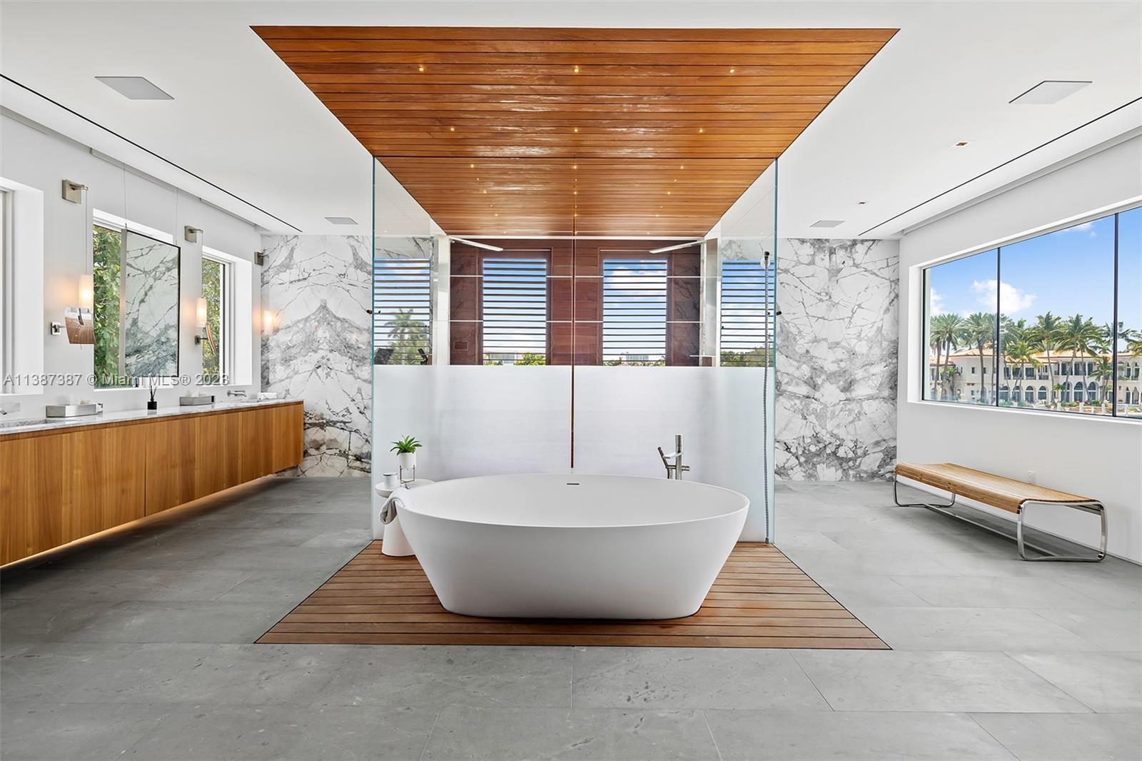 Entry into the Master Bathroom.  Windows to the East, South and West providing lots of bright light.  Electric blinds provide privacy as desired.