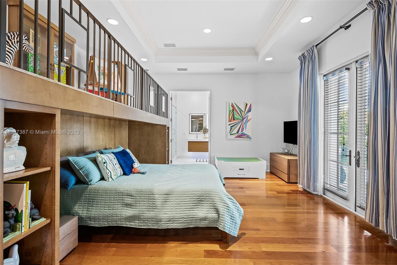 Secondary Bedroom currently setup for Child with play area above bed.  This room also has a walk in closet.