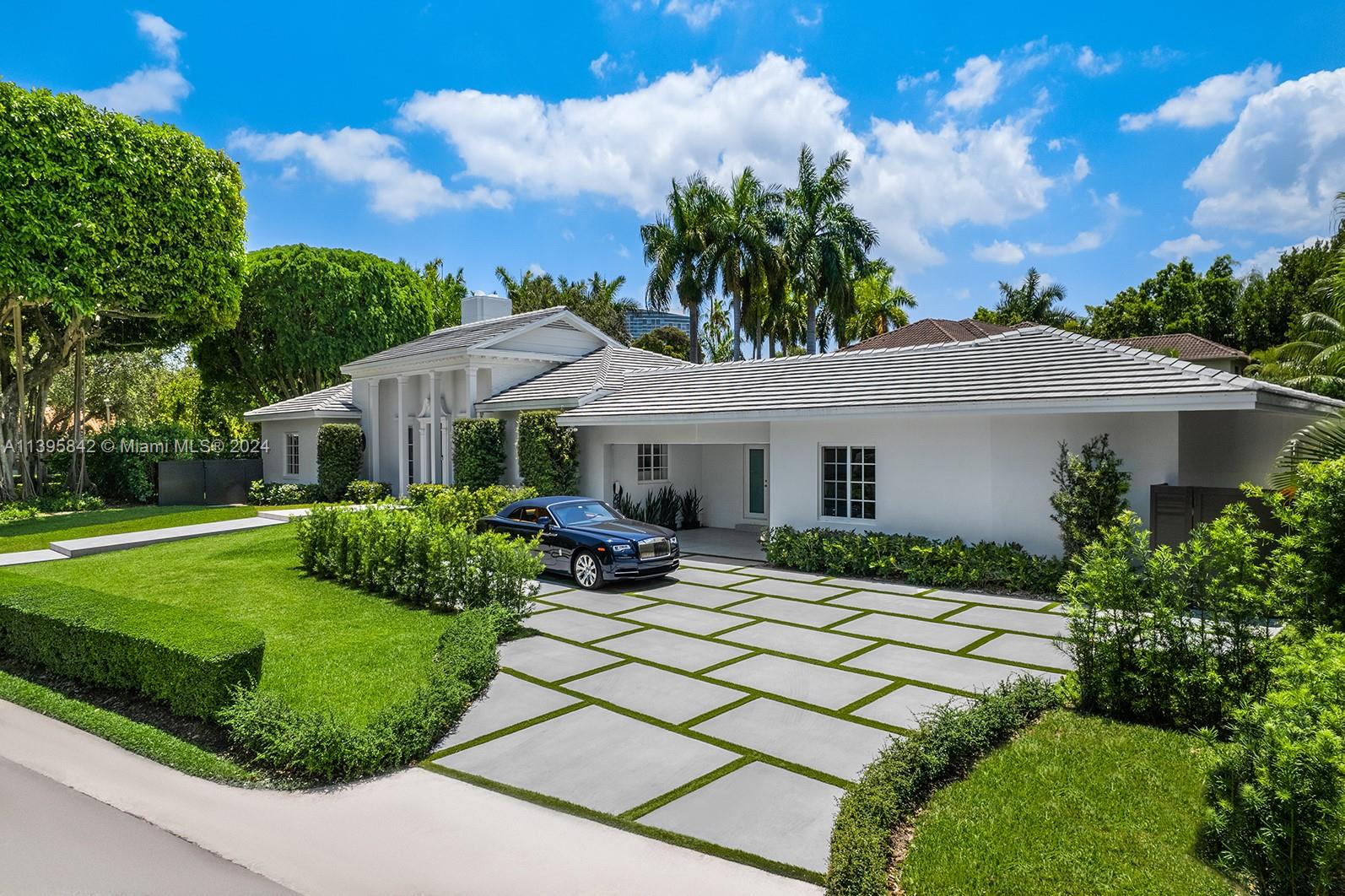 Casa Garden! Welcome to the next level home in the private and gated community of Bay Point. This one-story, fully renovated home sits on an oversized corner lot, featuring a perfect split floor plan with bright open spaces, high ceilings, and an open modern concept where living, family, and dining interacts with the beautiful garden views and the bonus oversized enclosed Florida room with side to side sliding windows. The kitchen offers top-of-the-line appliances, gas range, and a breakfast nook that makes you feel like you're eating in the garden. The outdoors features a spectacular landscape-defining banyan tree, surrounded by spacious green areas and new heated pool with spa, ideal for entertaining with family and friends. New roof, new impact windows, new bathrooms, new everything!