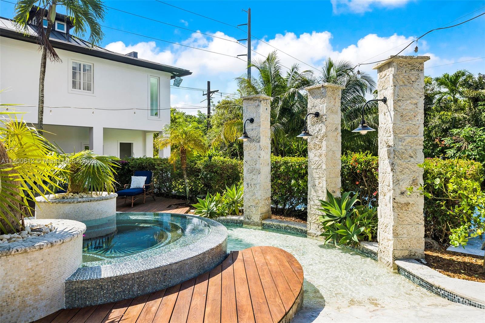 Florida coral flagging beach entry into designer pool