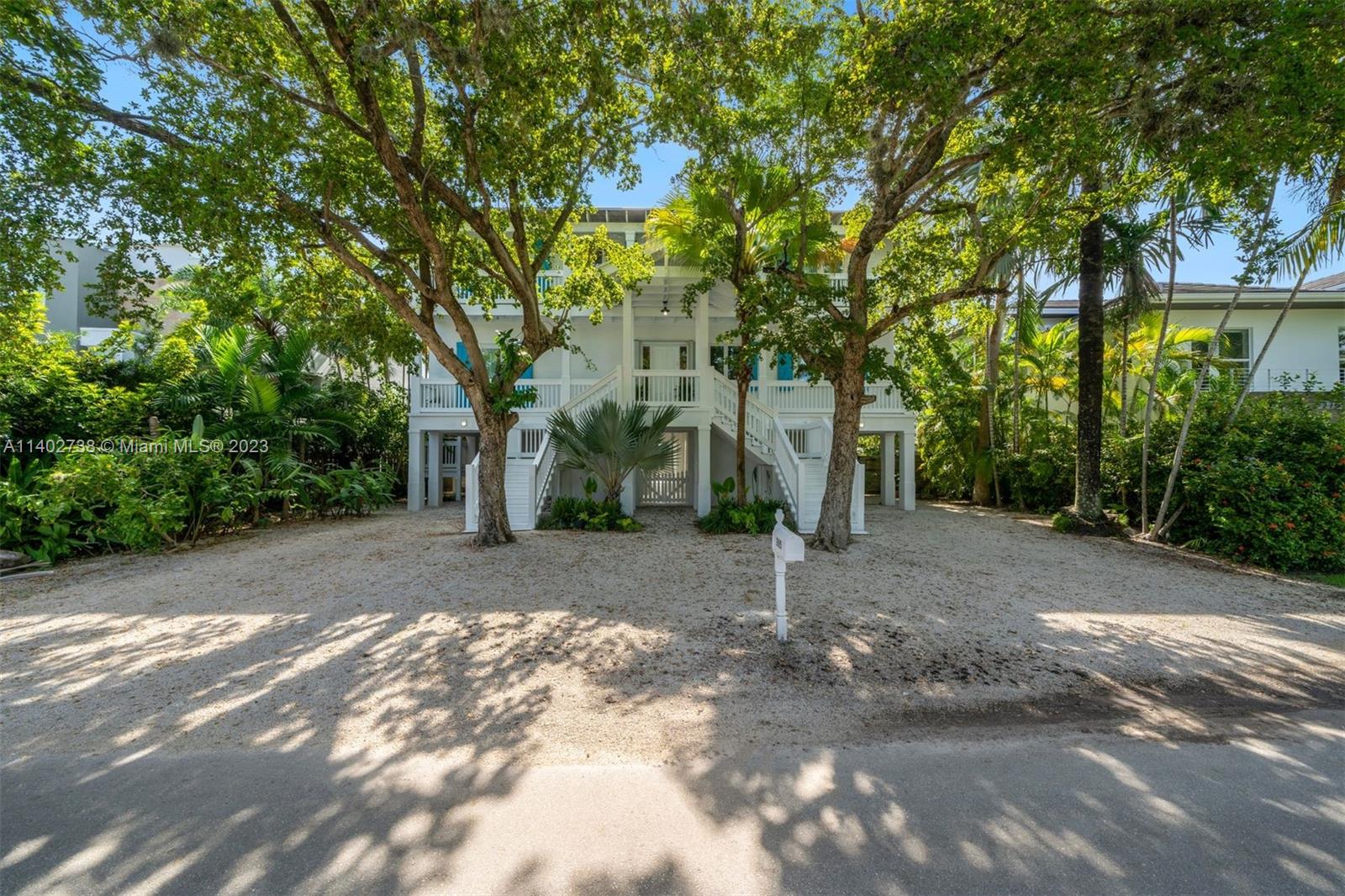 This gorgeous and unique home located on one of the quietest streets on Key Biscayne which sits on a 7841sqft lot features 4 bed and 4.5 baths, high ceilings and French doors create an airy and open ambiance and beautiful antique wood floors add a touch of warmth and timeless charm. The kitchen features custom cabinetry and built-ins. Highlights of this home include a spacious family room, which can easily be converted into a fifth bedroom, a wine cellar, and 2 expansive covered terraces ideal for entertaining, providing a seamless flow between the indoors and outdoors. The spacious main suite has a walk-in closet and a wraparound balcony. There is also a office space and potential area for a pool. 
A true gem in the coveted Key Biscayne combining luxury and the essence of coastal living.