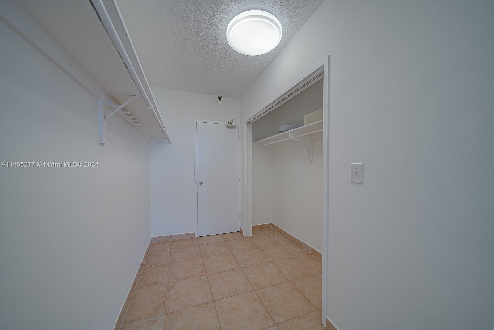 Large walk in hall closet easily convert to office space