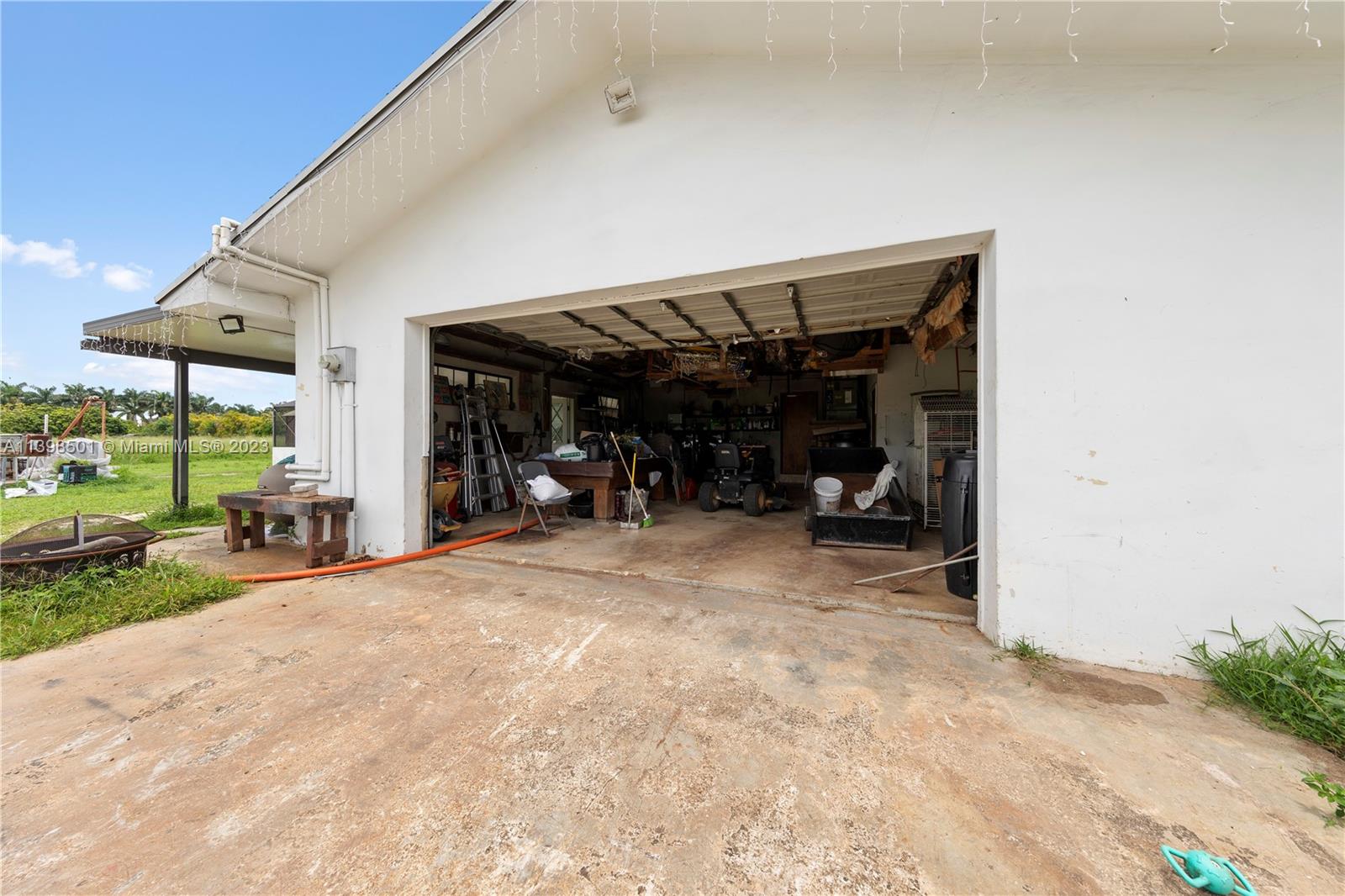 2 CAR GARAGE W MOWER REMAINING W SALE