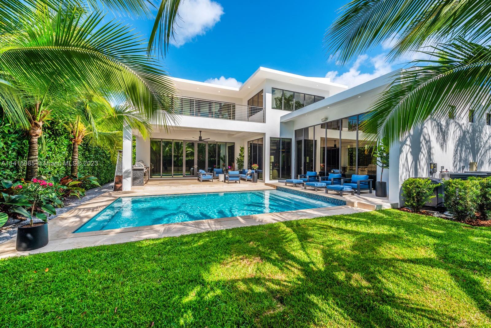 Exquisite, one-of-a-kind home on a quiet tree-lined street in coveted South Gables neighborhood. Designer finishes throughout this tropical modern masterpiece. Dramatic, light-filled living spaces feature walls of glass, 12’ ceilings, Italian stone flooring, Florense custom built-ins, wine storage & striking floating staircase. Experience the ultimate in indoor/outdoor living with an open floorplan that flows seamlessly. Stunning, European style kitchen w Fisher & Paykal appliances and opens to expansive family room. Ultra-private primary suite has spa-like bath with glass enclosed shower & overlooks balcony. State-of-the art Smart Home features + 1 Car Gar. (w/lift). Idyllic outdoor spaces offer a summer kitchen & heated pool overlooking a lush tropical garden.