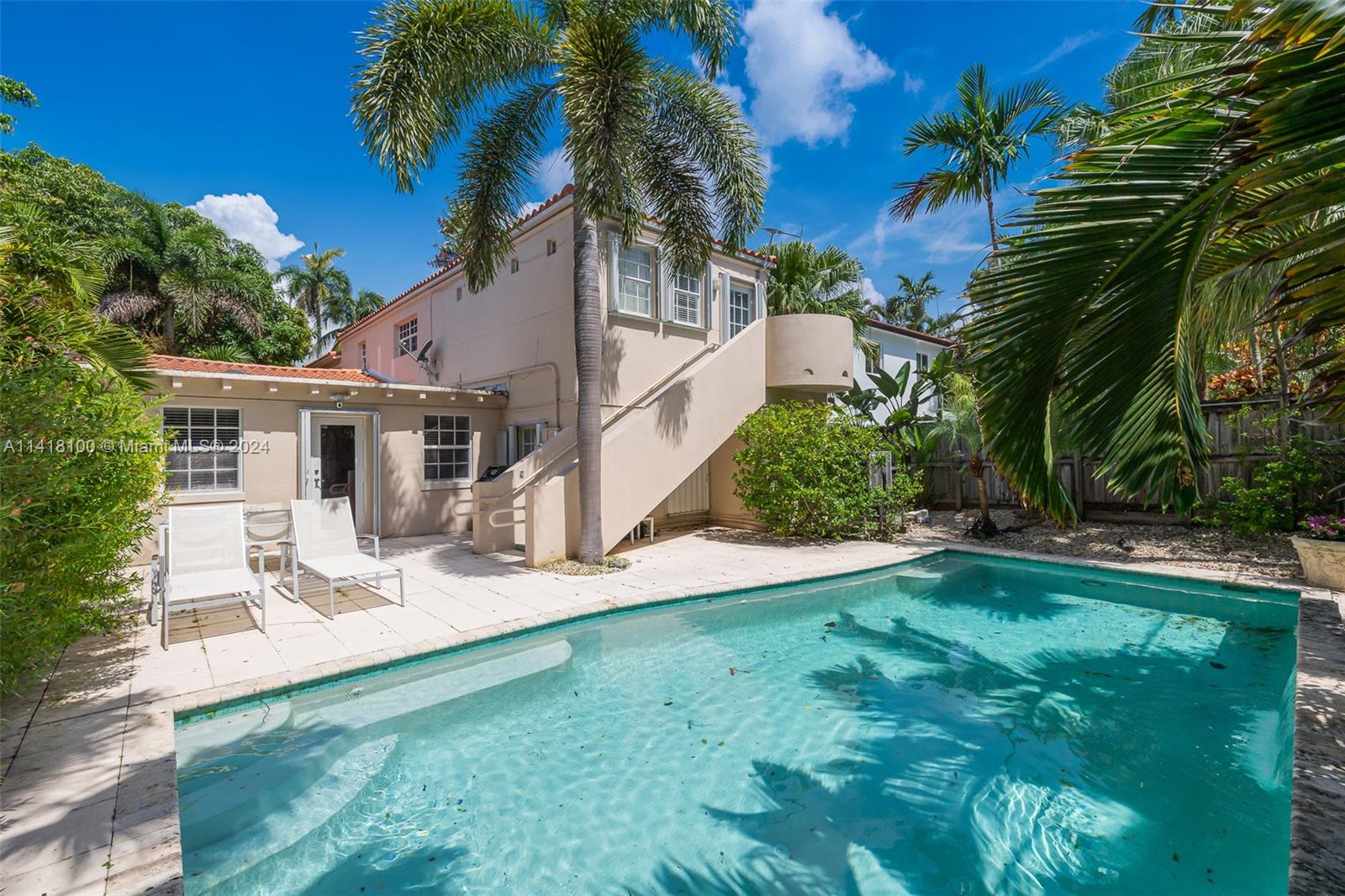 This spacious updated Miami Beach home with historic charm has 3,305 Sqft. under air. Enter through a tranquil butterfly garden & feel right at peace.  Sprawling floor plan with lots of natural light with skylights has four bedrooms and four bathrooms. Vaulted ceilings with exposed original beams centered around a beautiful fireplace in the large formal dining room. Remodeled eat in kitchen with island. The private owners suite with renovated ensuite has an attached bonus room area with a private entrance. Ample closet and storage space. Entertain in this private backyard oasis with a newly resurfaced pool. Multiple zone, energy efficient A/C systems. Never lose power. Full home natural gas generator. Tesla charging station. Minutes to all that Miami Beach has to offer.