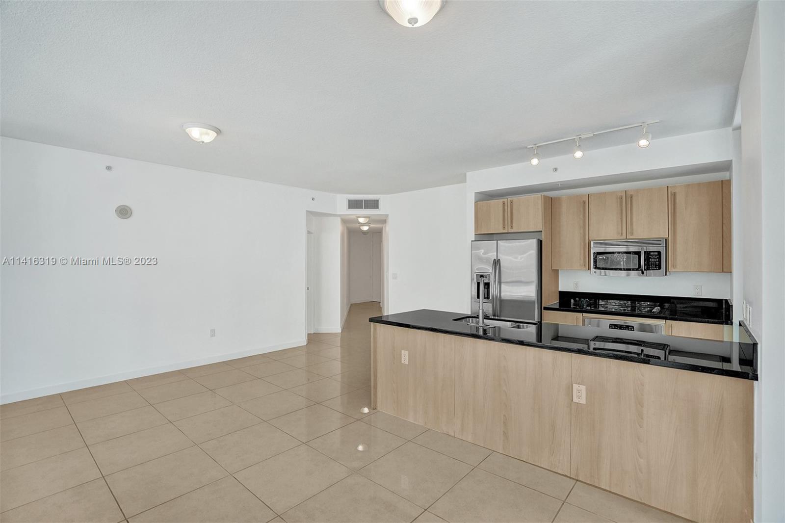 Ceramic tile throughout the entire unit