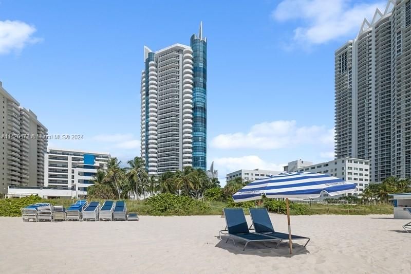 Stunning ocean, intracoastal & bay views from high floor spacious 2BR/2BA in full service oceanfront building in Miami Beach. Unit sold furnished. Floor to ceiling windows allow the water views to be enjoyed from many vantage points & provide abundant natural light. Other features include open floor plan, tile floors, large primary suite privately set off from living area, and 2 balconies, of which one is accessible from the bedrooms. Two assigned/covered parking spaces & 1 assigned storage locker. Building has lovely lobby & common areas, along w/resort-style amenities, such as gym, pool & beach service for chairs/umbrellas. Conveniently located to shopping & restaurants, as well as to South Beach, Surfside & Bal Harbour. NOTE: Floor plan shows north balcony only; west balcony not on it.