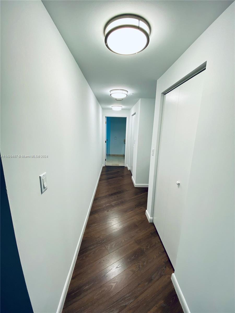 Hallway with two huge walk in closets